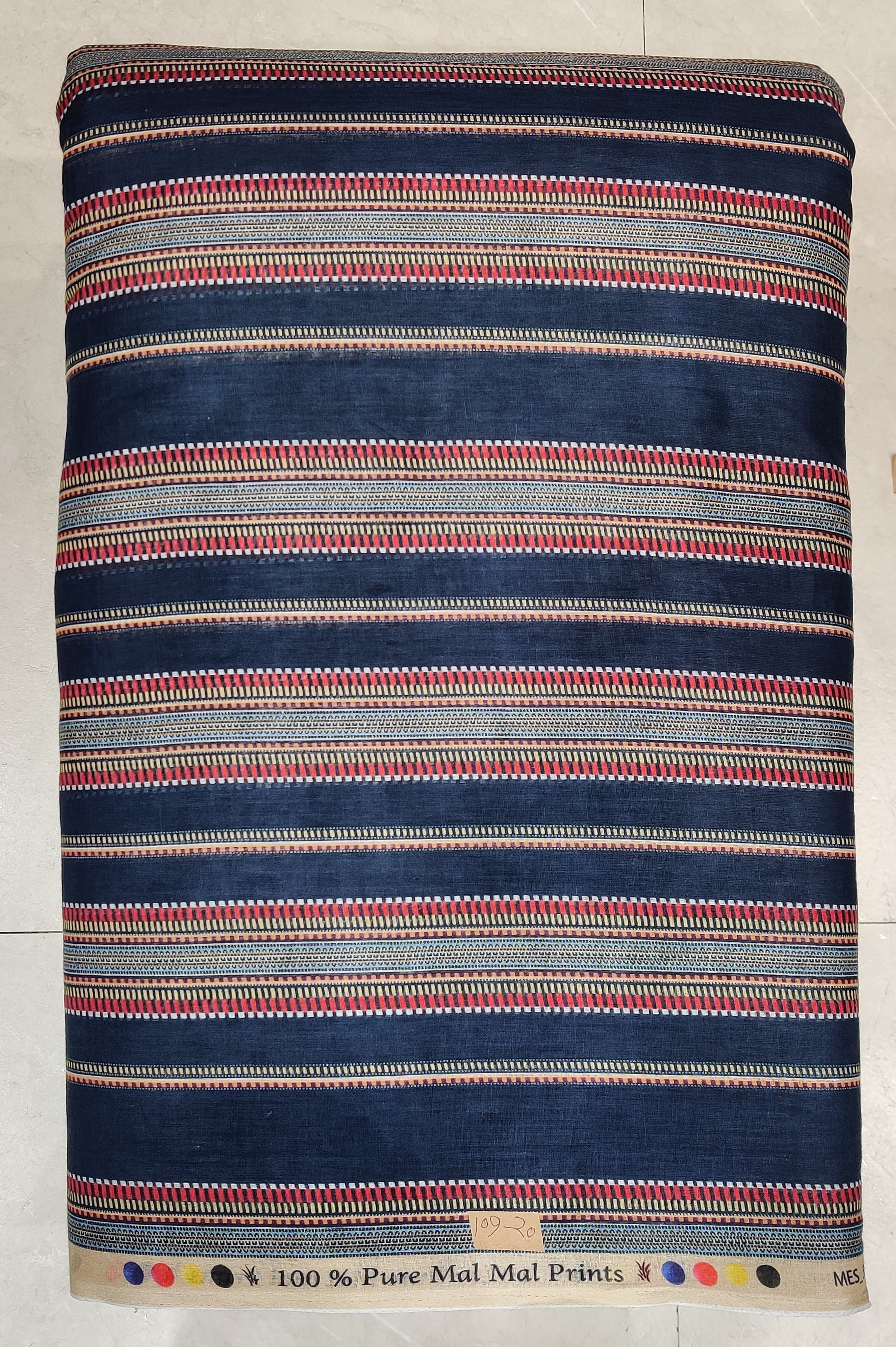 A fabric sample with horizontal stripes in navy blue, red, yellow, black, and beige, labeled as '100% Pure Mal Mal Prints' at the bottom.
