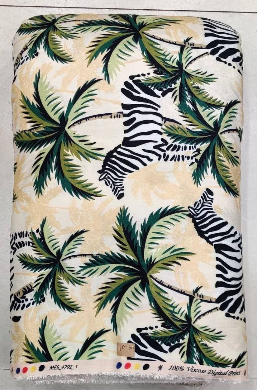 Rich golden-amber and deep olive-green fabric featuring a large-scale abstract botanical composition with sweeping curved leaves, fluid organic shapes, and a smooth dual-tone contrast.