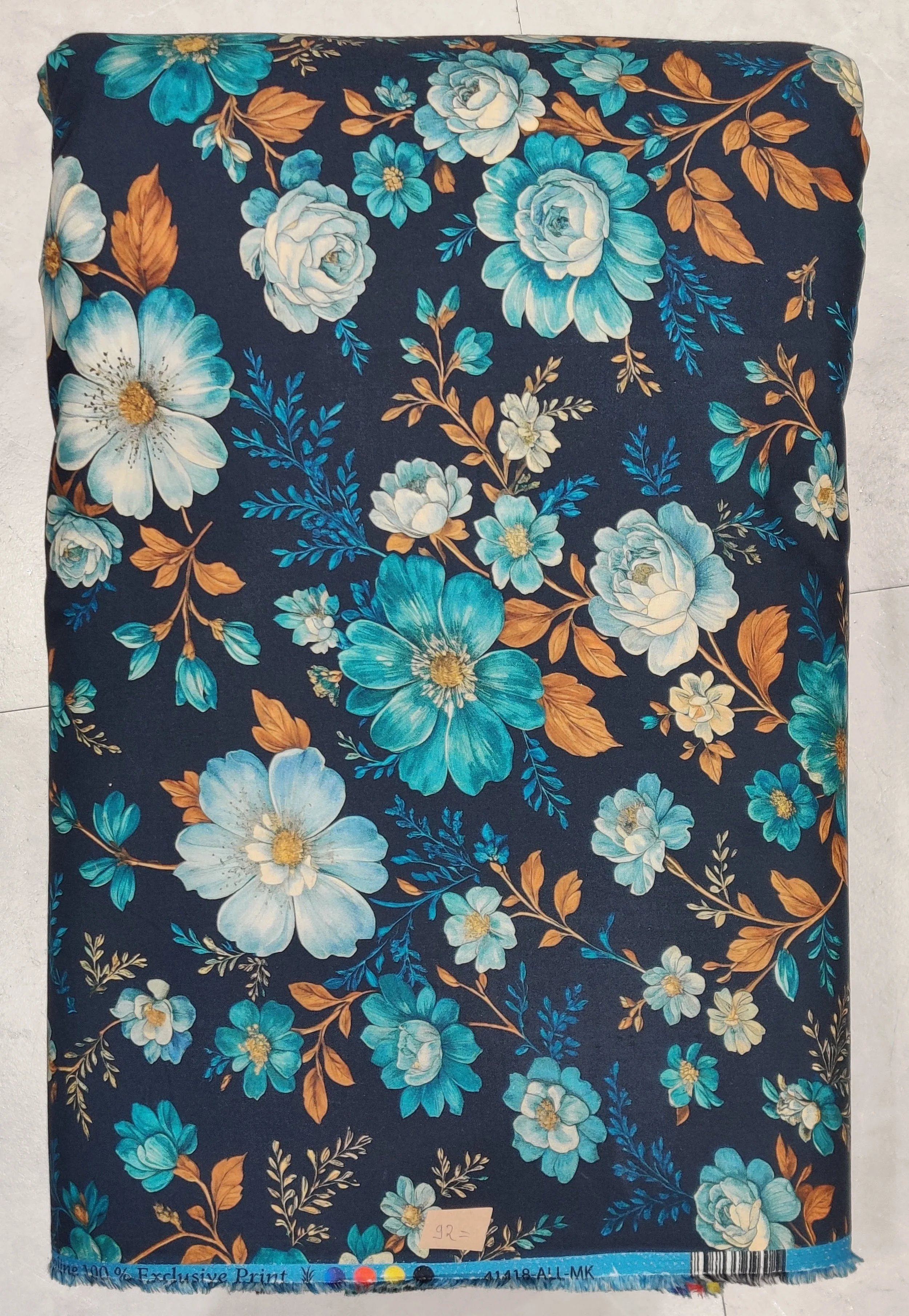 Vibrant dark turquoise background featuring a traditional, ornate ethnic print with repeating medallion motifs, intricate geometric borders, and fine botanical details.