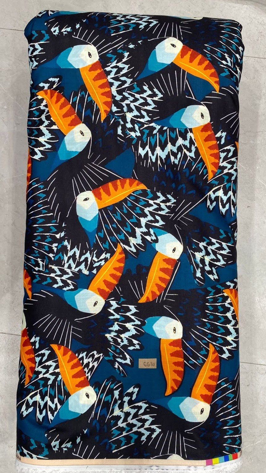 Deep navy-blue fabric featuring a dense print of stylized white toucans and tropical foliage.