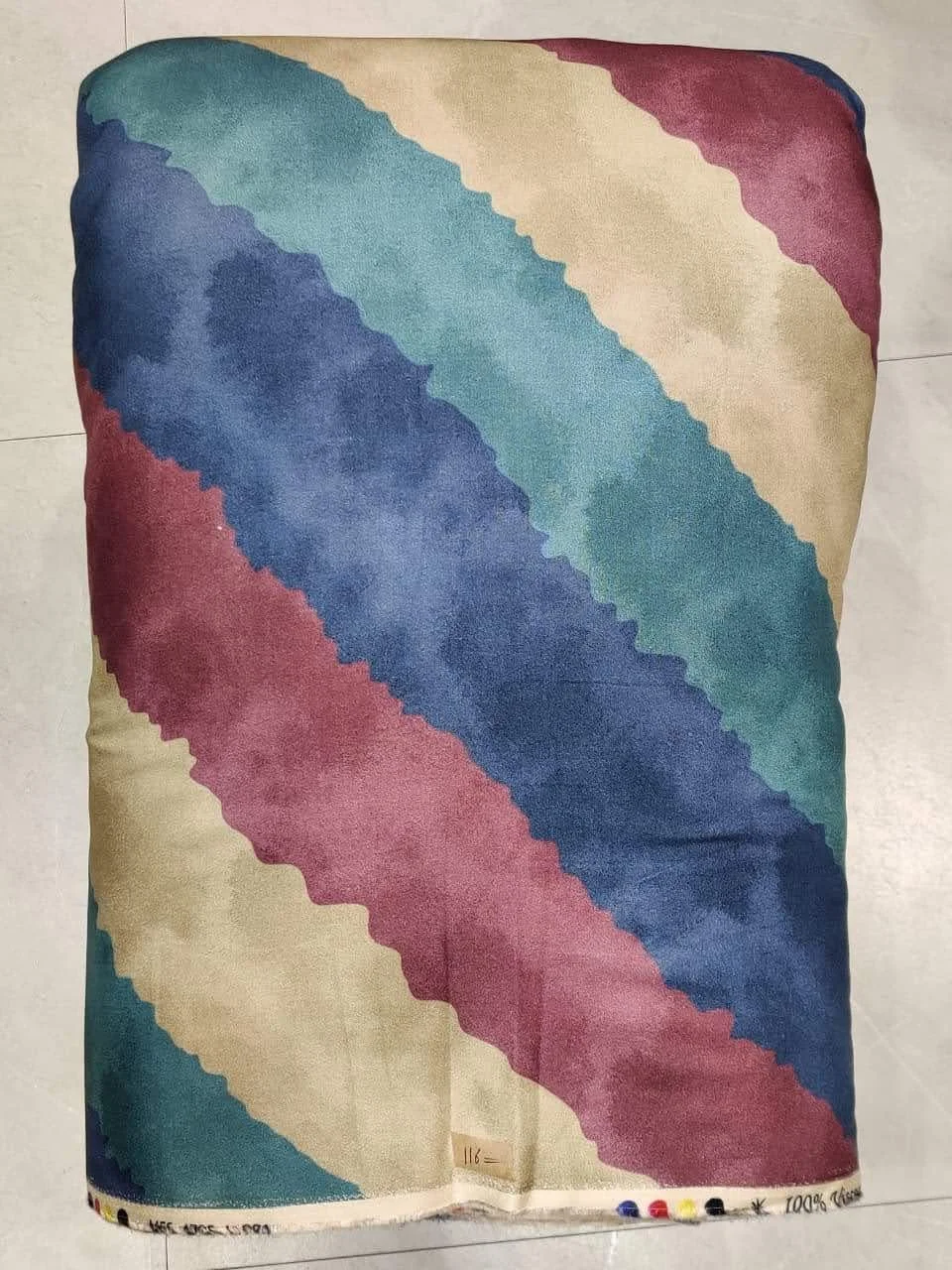Soft pastel-lavender and muted sage-green woven fabric featuring a diagonal color-blocked stripe layout with subtle heathered grain textures, gentle tonal shifts, and clean diagonal dividers.
