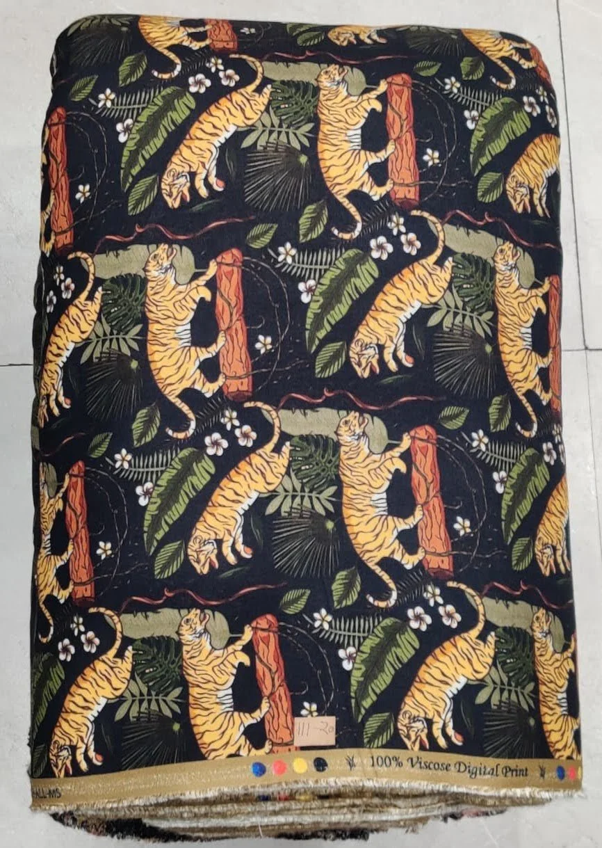 Radiant ivory and lush jungle-green fabric featuring an illustrative wildlife composition with exotic tigers, blossoming floral branches, and vibrant foliage accents.