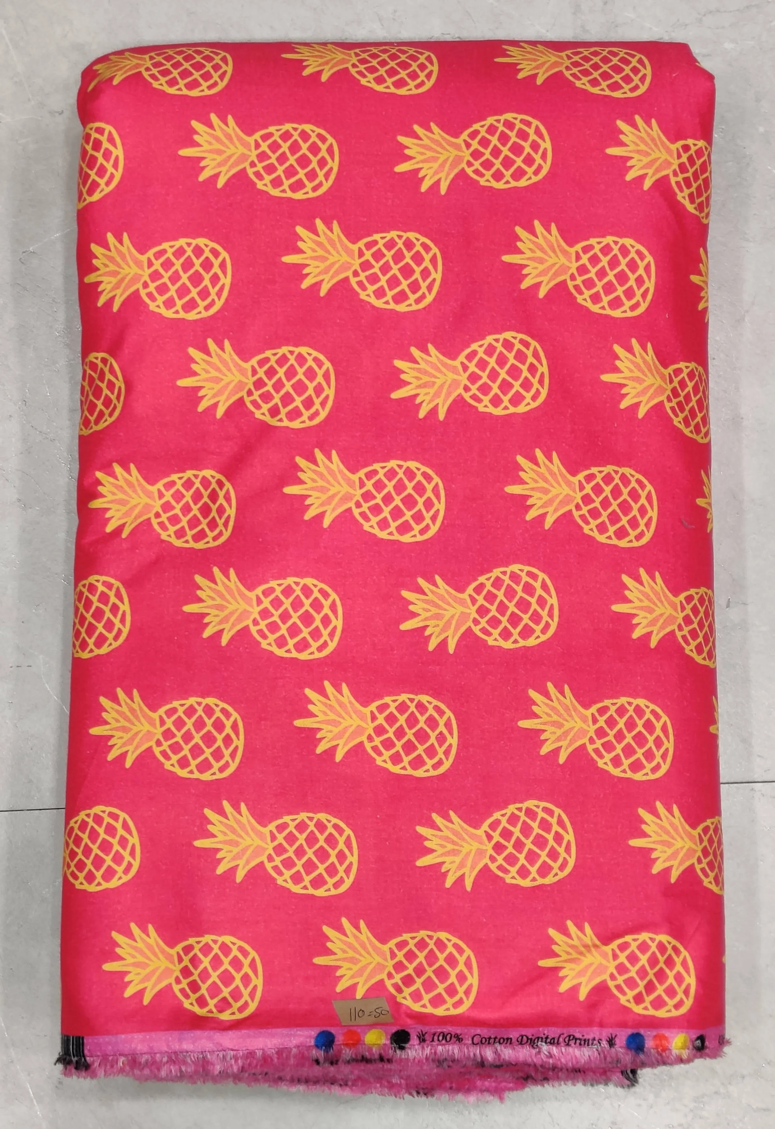 Vibrant pink and yellow tropical pineapple print, perfect for crafting playful summer dresses and breezy resort wear.