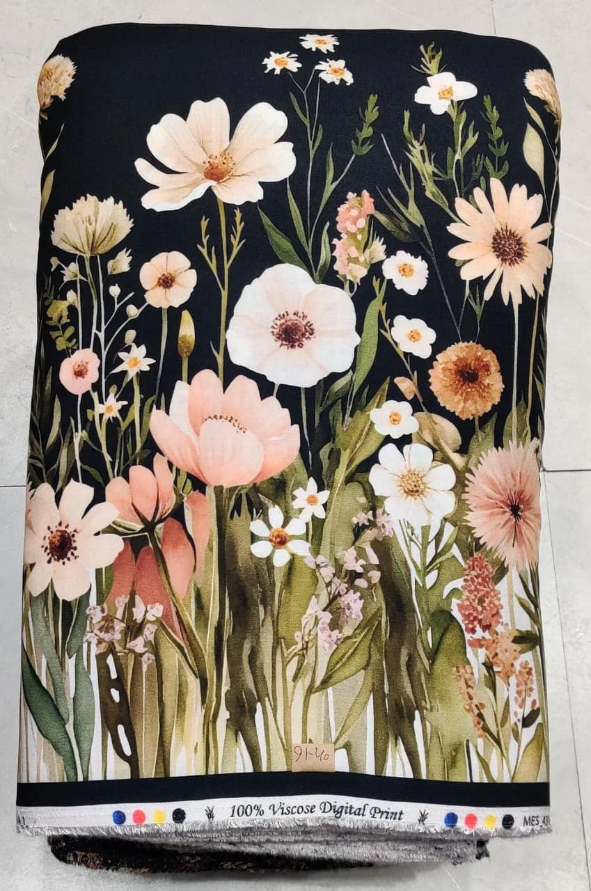 Luxurious ivory and deep forest-green textile featuring an expressive botanical composition with large blossoming poppies, delicate wildflower stems, and smooth flowing foliage accents.