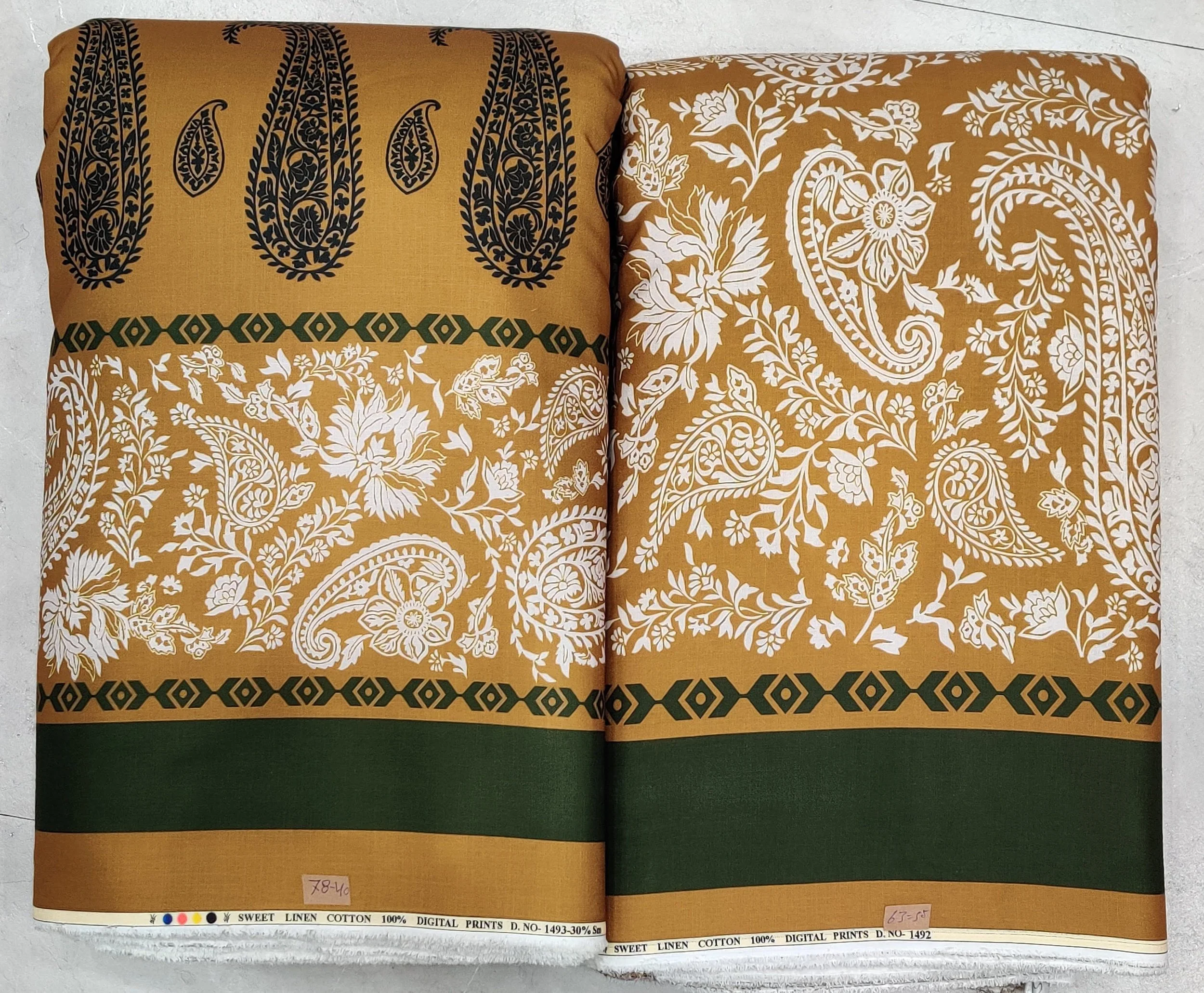Rich gold-ochre and olive-green fabric with an intricate paisley top motif, ornate decorative borders, and a solid hemline band for matching top and bottom wear.