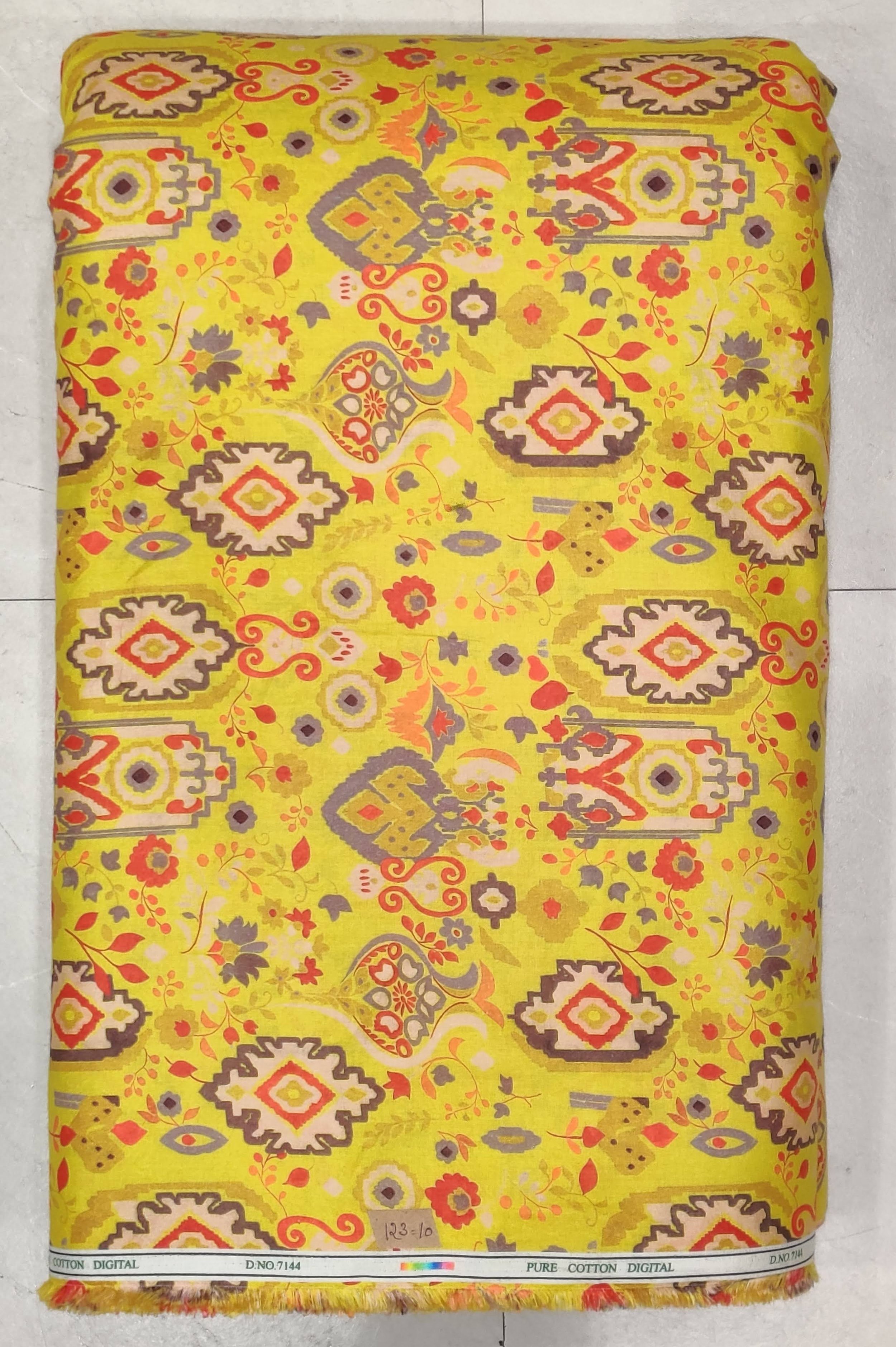 Vibrant yellow base featuring an intricate traditional geometric print with diamond motifs and floral accents in shades of pink, red, and blue.