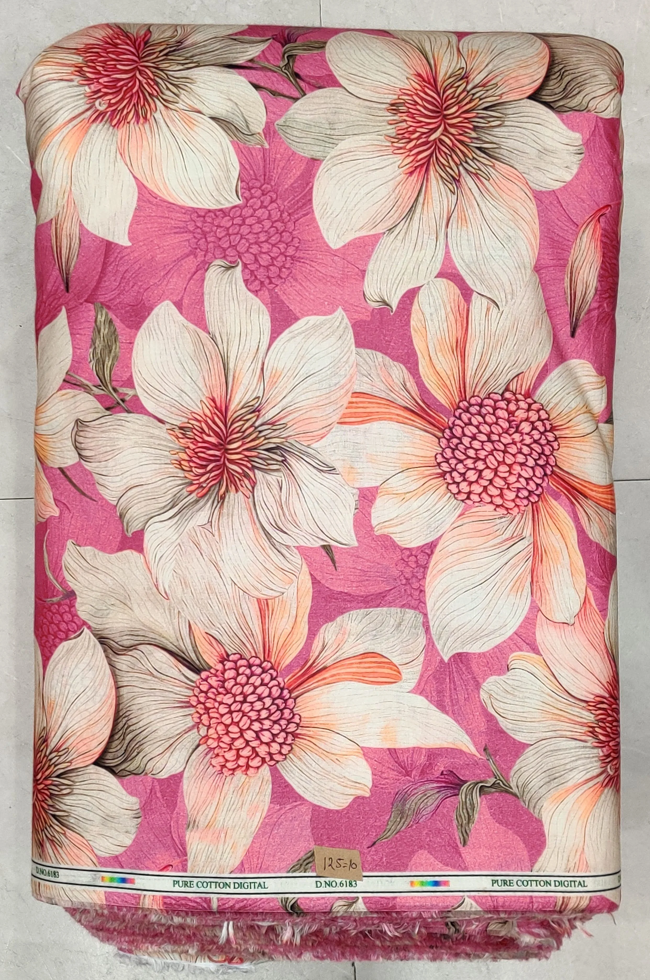 Dark background covered in a dense, colorful mix of small paisley and floral patterns in shades of pink, blue, yellow, and green.