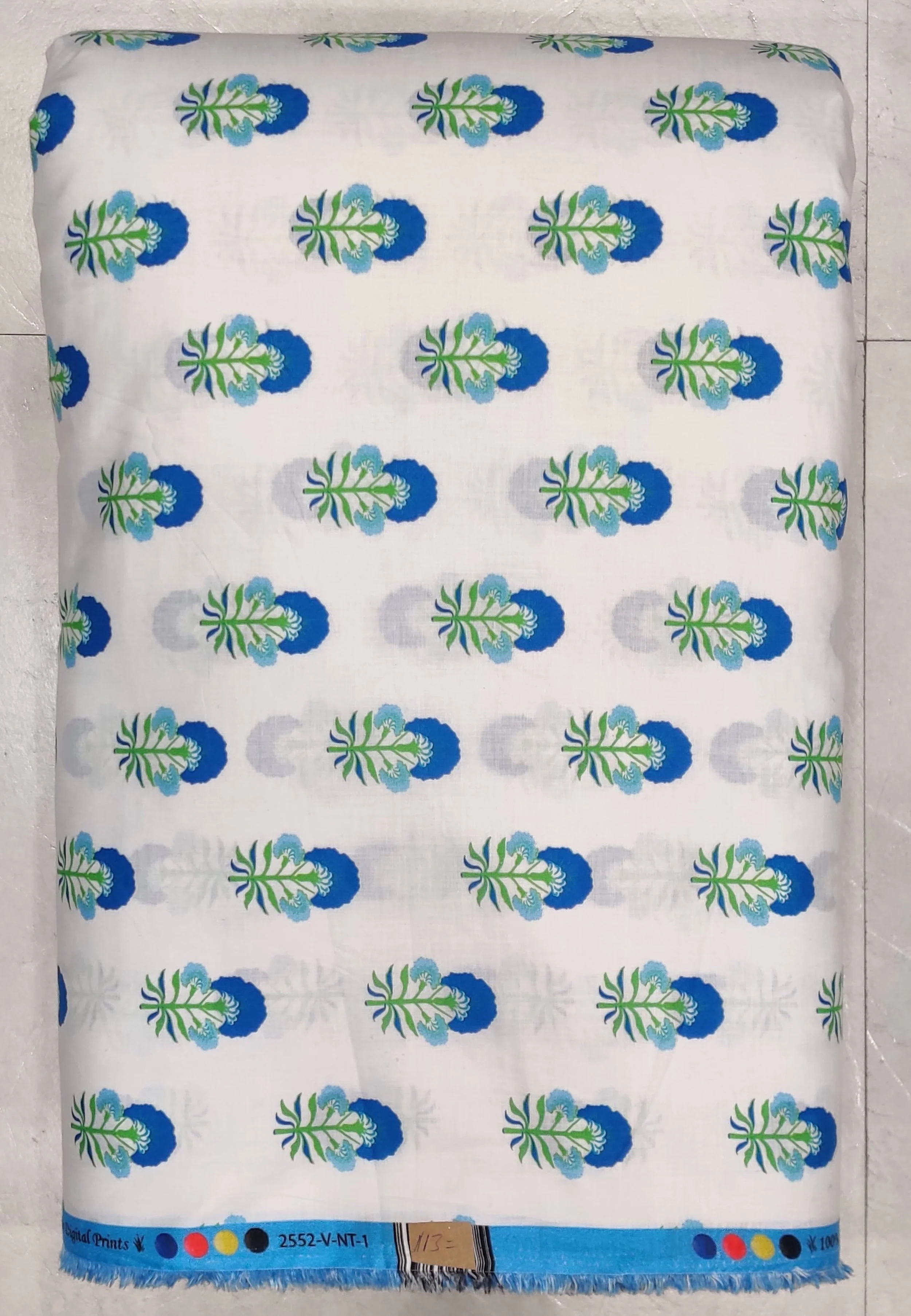 White background featuring repeating, evenly spaced rows of small blue and green block-style motifs that resemble stylized floral buds or tiny planters.