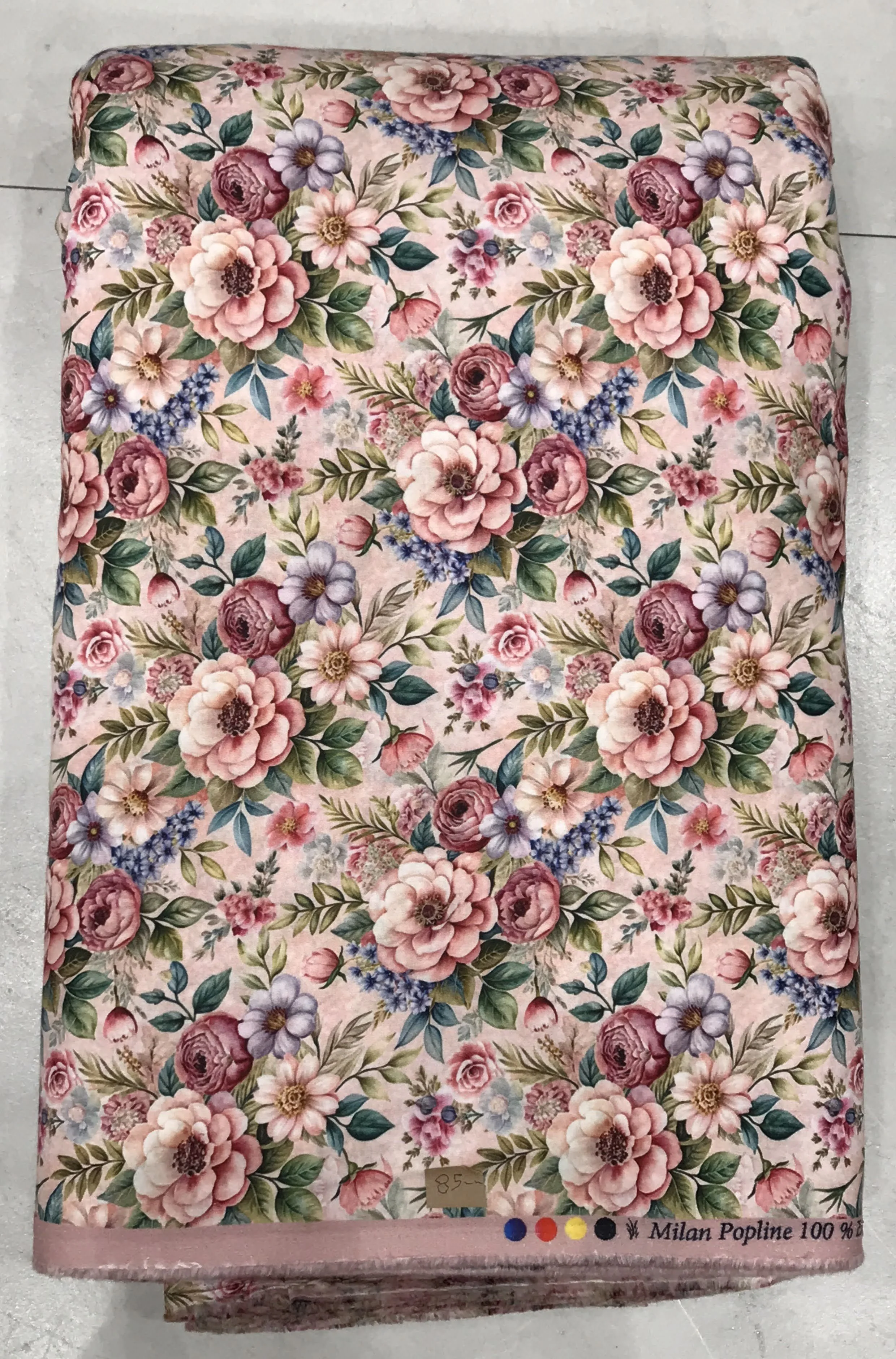 Rich cream and beige background featuring a dense, classic vintage English rose floral print in soft pinks, muted reds, and delicate olive green foliage.