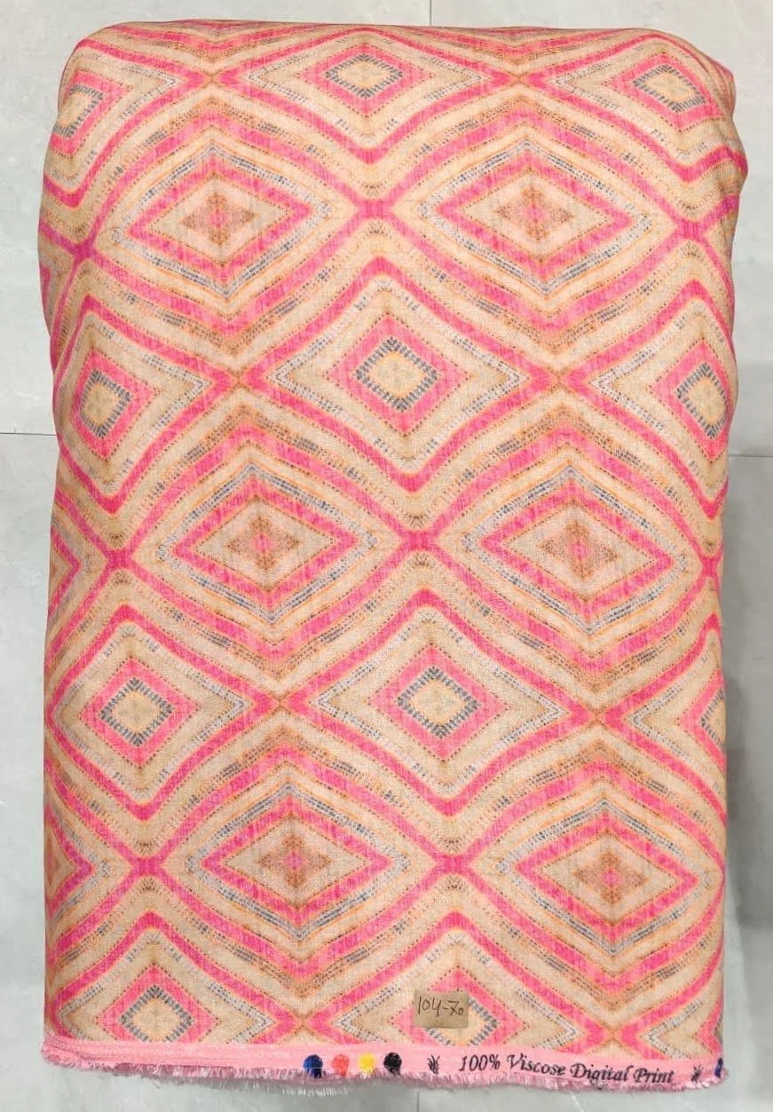Vibrant peach-pink and sunlit coral satin textile showcasing a repeating geometric diamond pattern featuring soft chevron infills, precise lattice framing, and clean symmetrical alignment.