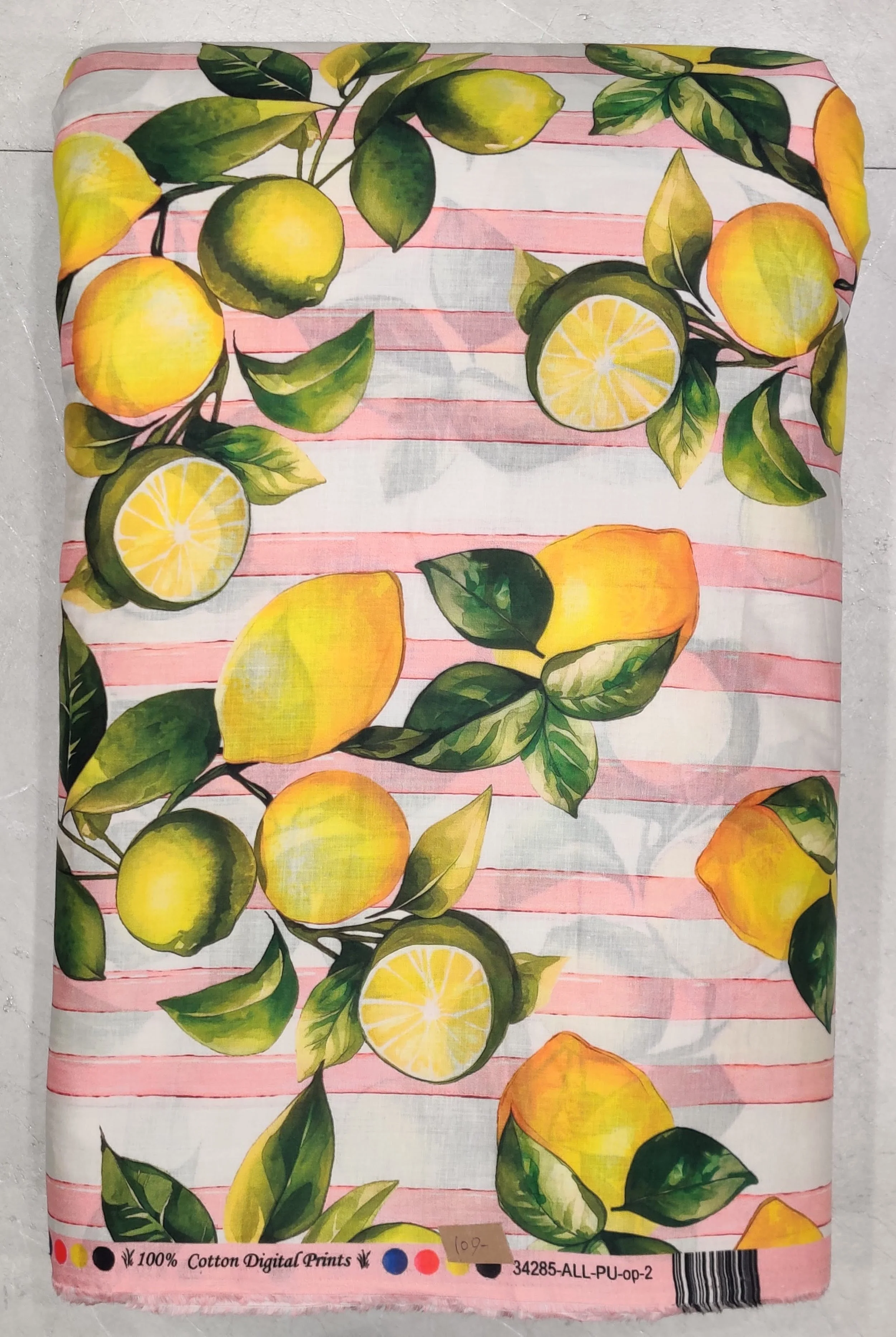 Vibrant print featuring yellow lemons and green leaves scattered across a background of soft pink and white horizontal watercolor stripes.