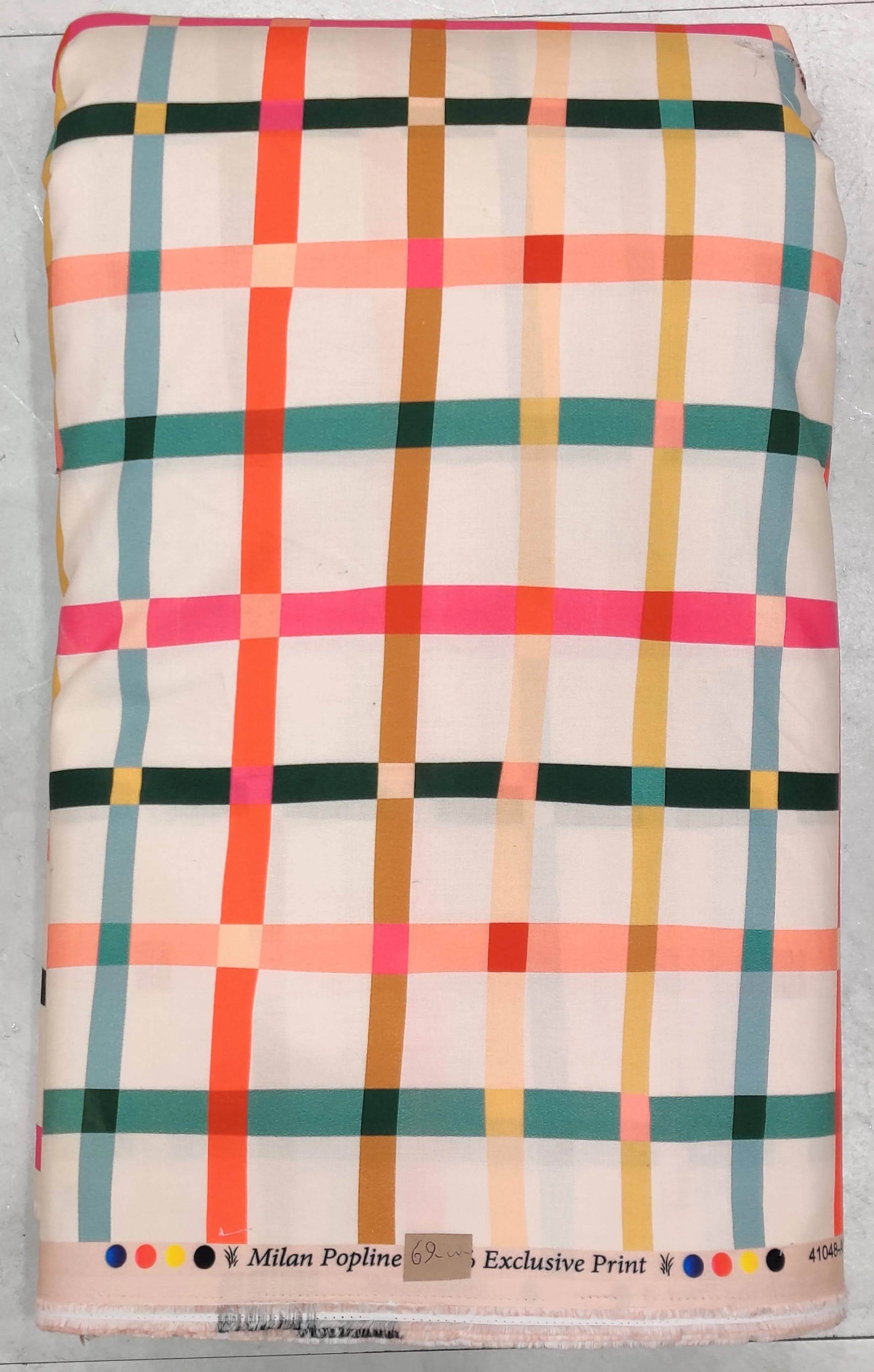 A vibrant plaid or grid-patterned fabric featuring a clean white background intersected by bold horizontal and vertical lines in bright coral-pink, vivid orange, deep navy blue, and rich olive green.