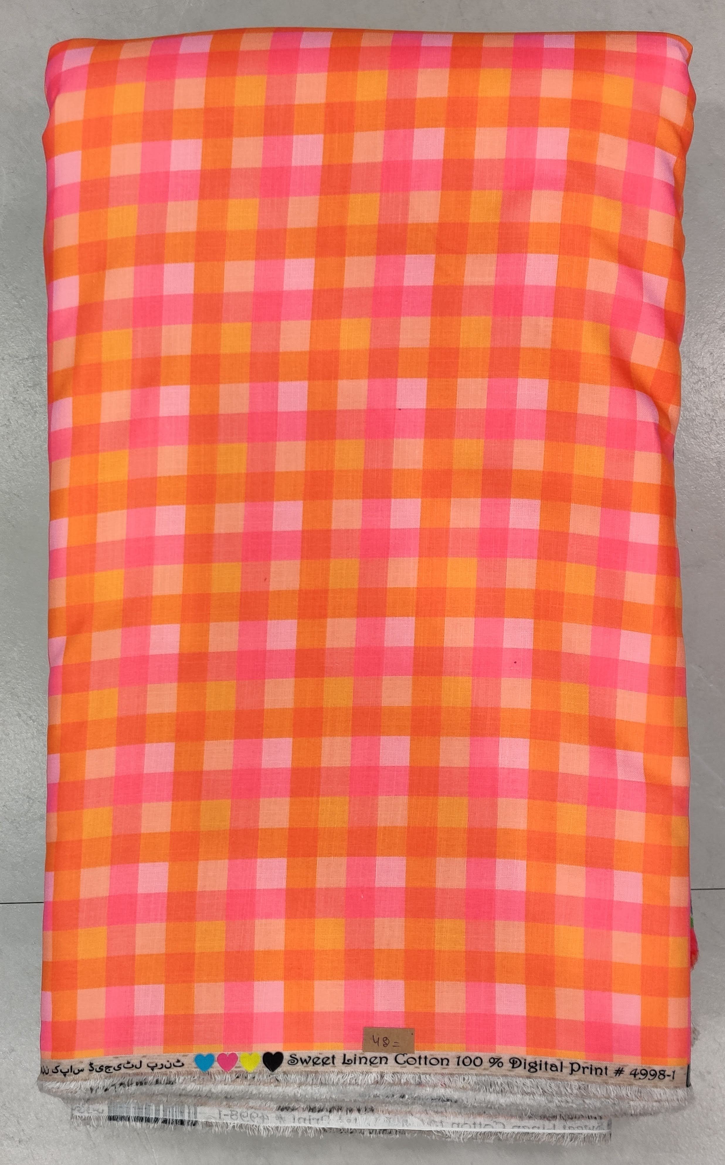 Vibrant orange-and-pink checkered fabric featuring a fine grid pattern with intersecting white lines, ideal for contemporary apparel and chic summer co-ord sets.