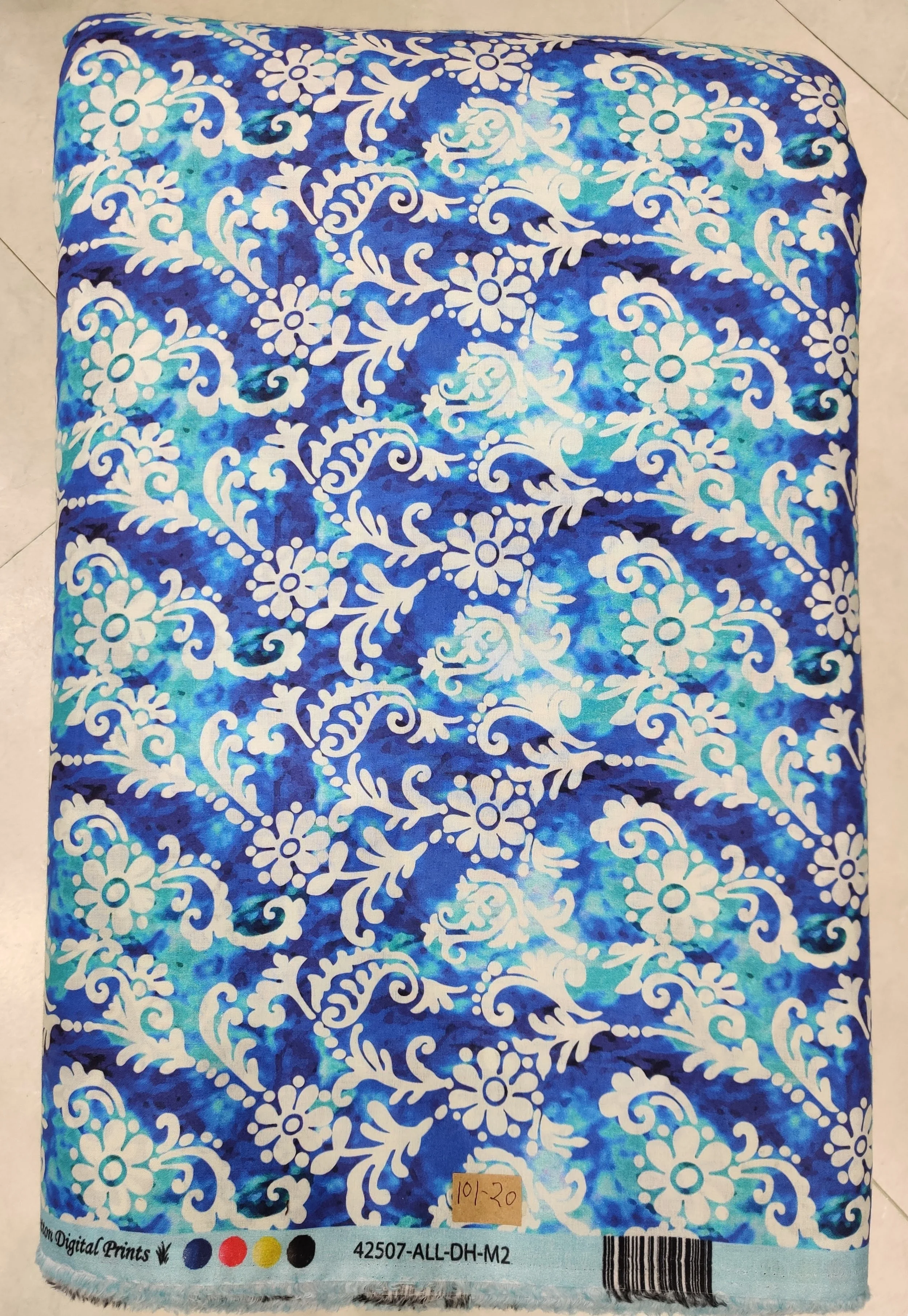 Luminous cobalt-blue and pearl-white fabric presenting a baroque damask layout with ornate scrolling flourishes, classic damask medallions, and crisp contrasting outlines.