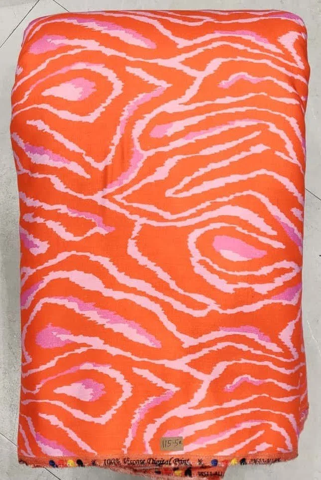 Bright orange fabric with pink and white abstract wavy geometric pattern