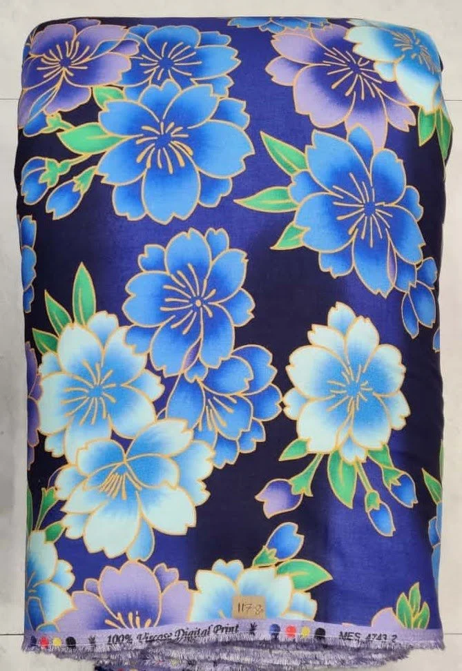 Polished sapphire-blue and glacial-silver silk featuring a symmetric medallion layout embellished with radiant starburst flourishes, delicate interlocking geometric frames, and crisp tailored borders.