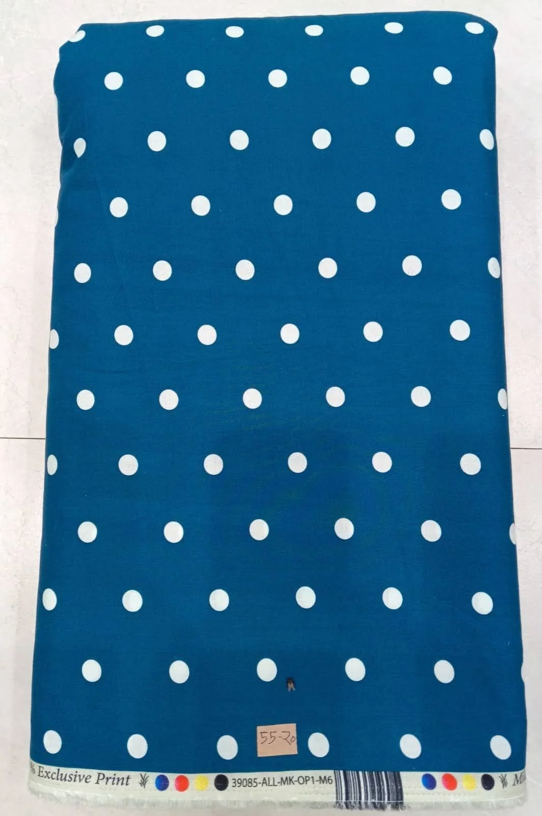 Deep indigo-blue background featuring a traditional, intricate ethnic print with delicate white floral motifs, tiny geometric patterns, and fine linear borders.