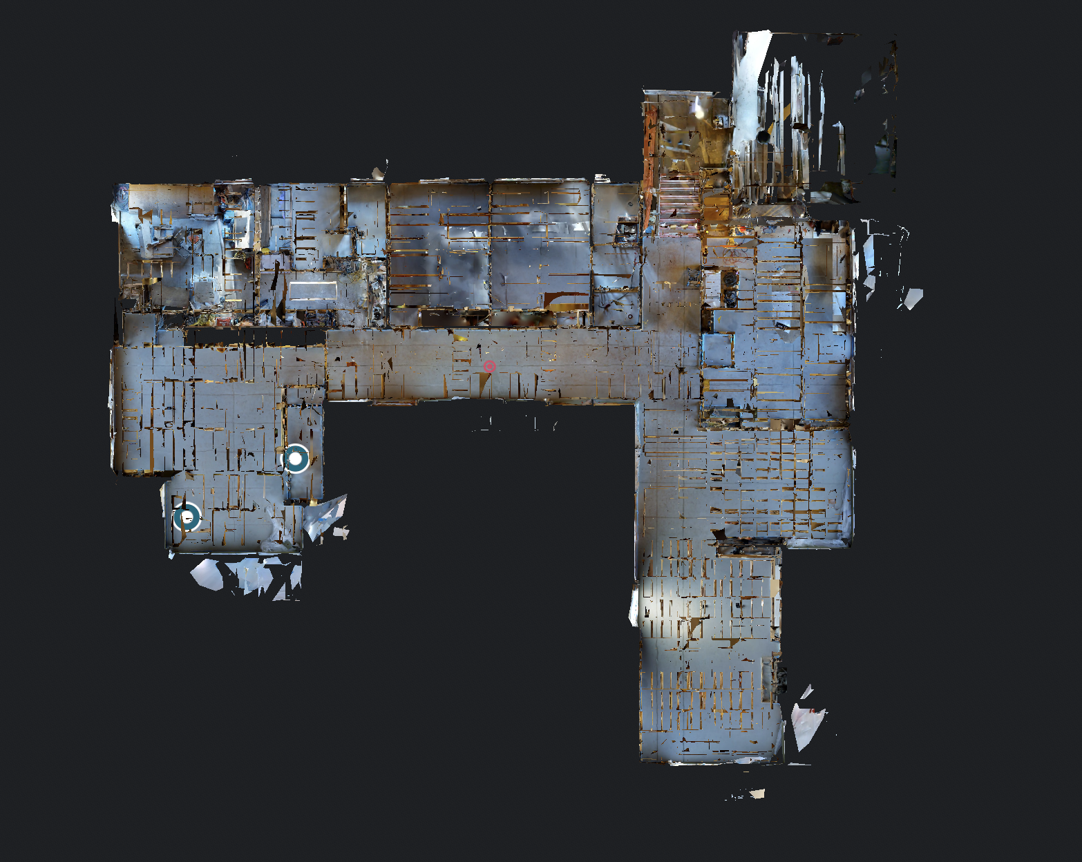 3D-model af en bygning set fra oven, med synlige vægge og etager, på en sort baggrund.