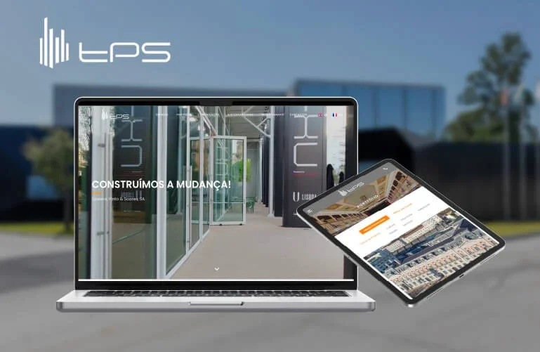 Imagem de um laptop e um tablet mostrando a fachada de um prédio comercial com o logo 'LPS' e a frase 'Construímos a mudança!' ao fundo, ao ar livre com céu claro.