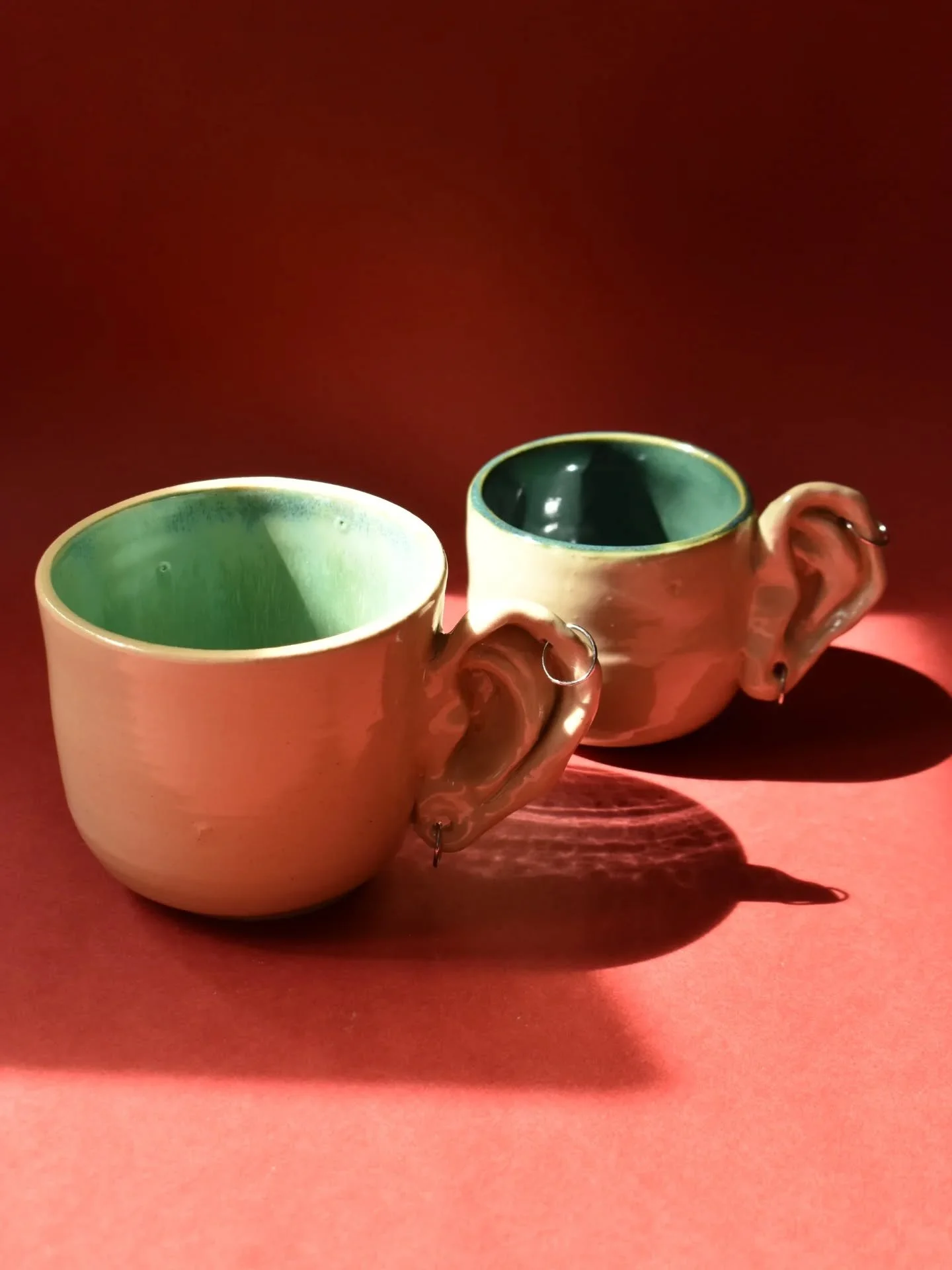 These mugs are all ears when you spill your secrets to your friends over a cup of tea 👀👂🏾

Available in many colors, big and small, pierced and unpierced. They will be for sale alongside many of my other ceramics, sculptures, screenprinted bags, p