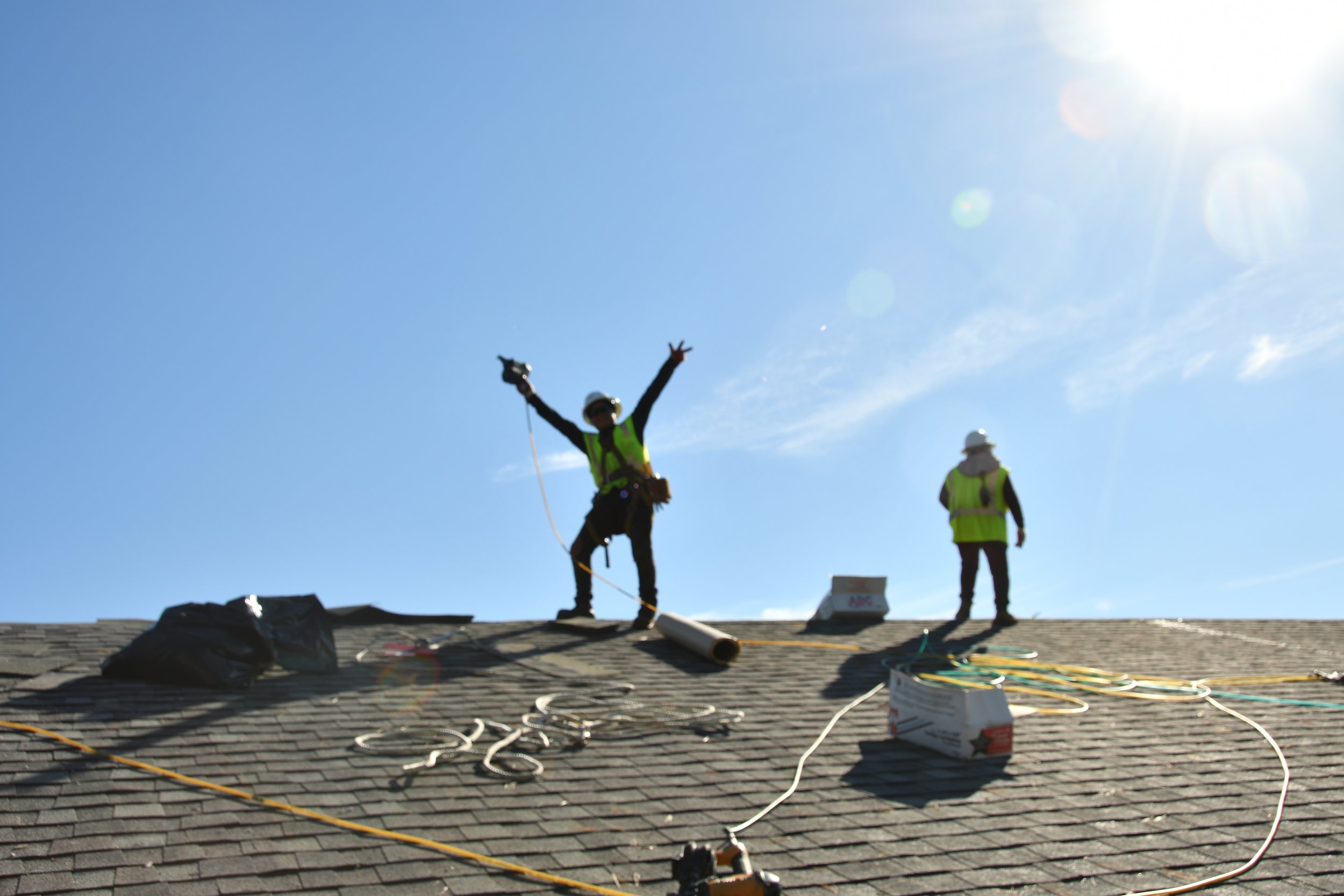 Workmen on roof of church
