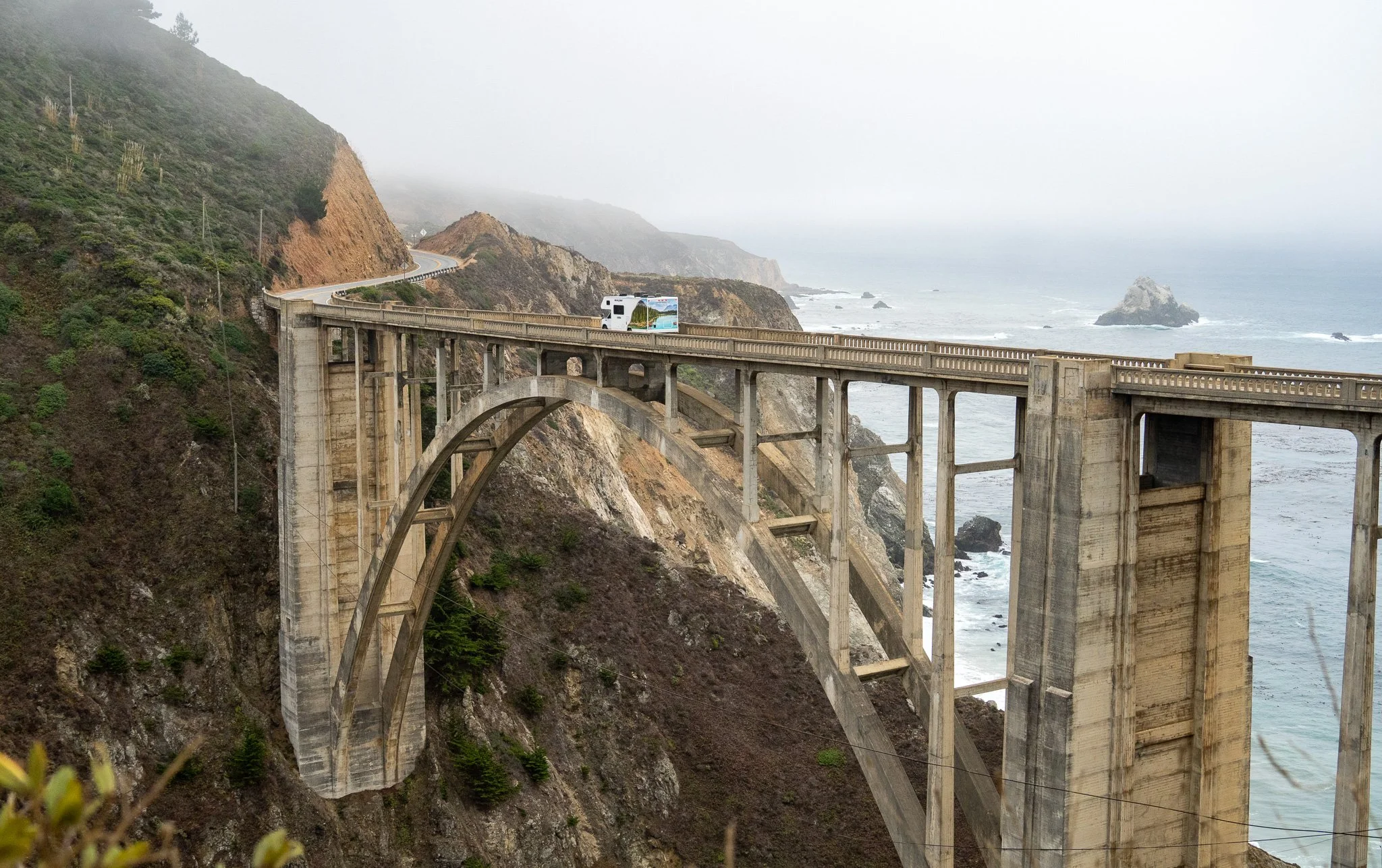 rv driving over bridge, monterey, california, usa