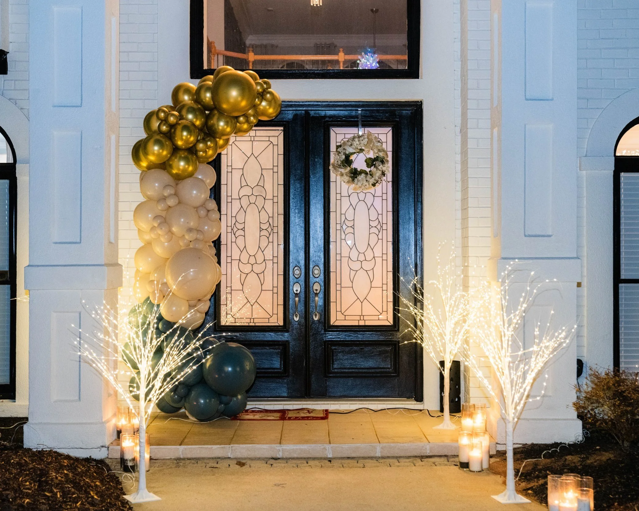 gold, white, and turquoise outdoor balloon garland for a corporate event in Atlanta