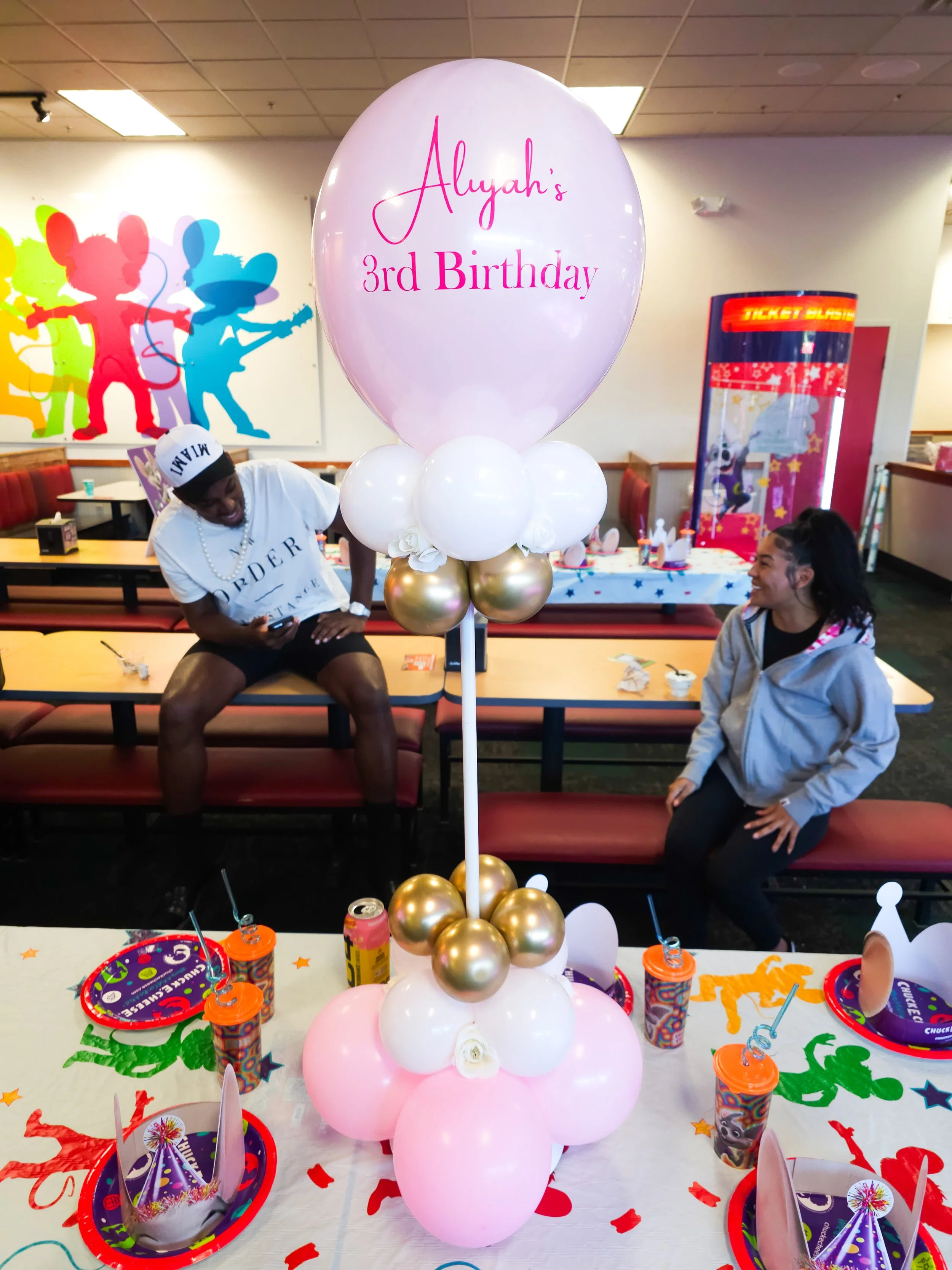 pink, white, and gold balloon table centerpiece for a kid's birthday party in Atlanta