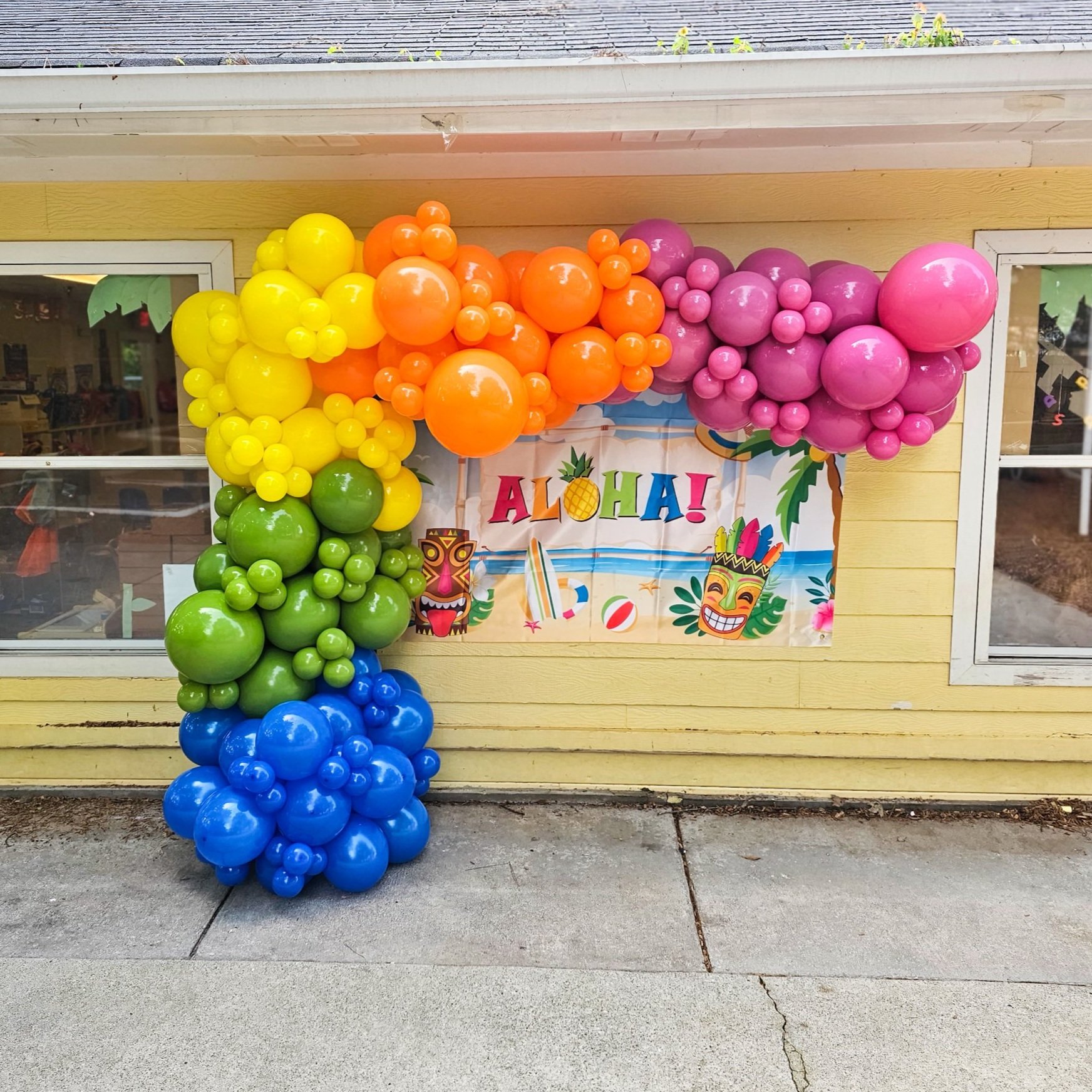 rainbow Hawaiian tropical luau balloon garland for a Pre K graduation in Atlanta