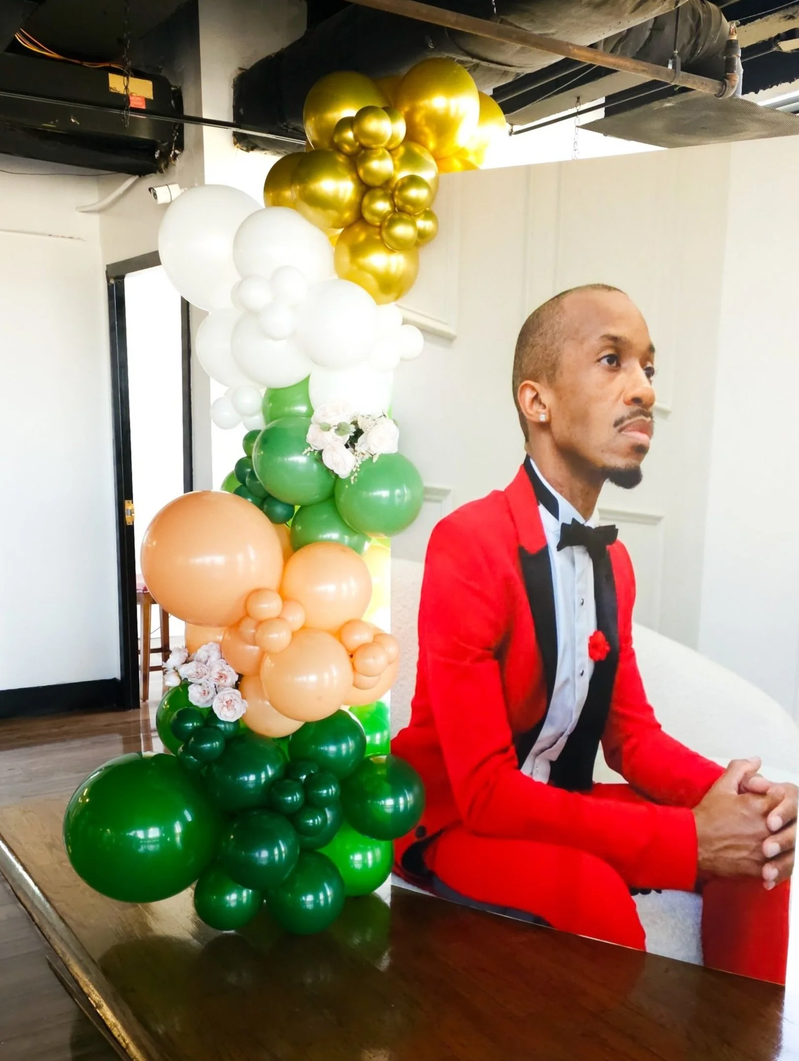 green, white, tan and gold standee balloon garland for a birthday party in Atlanta