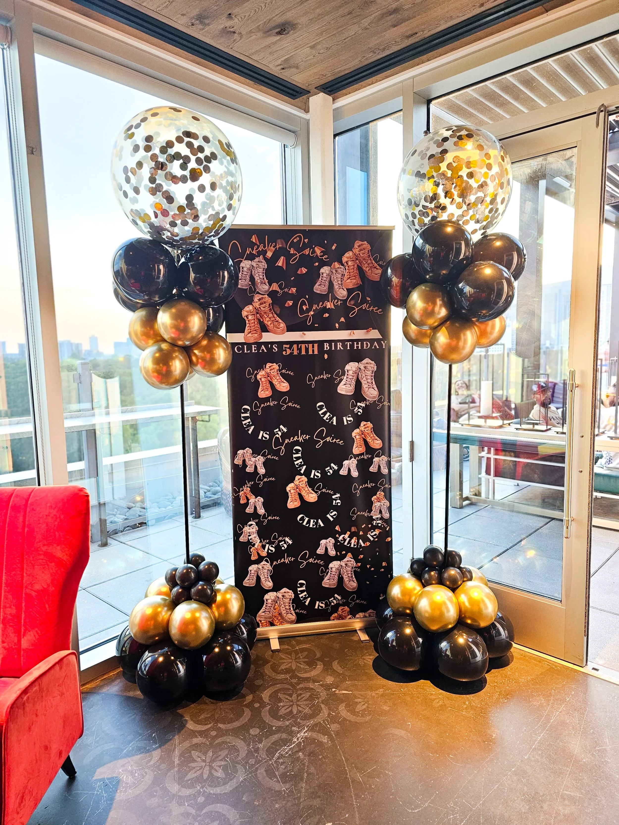 black and gold balloon topiary columns for a sneaker ball birthday in Atlanta