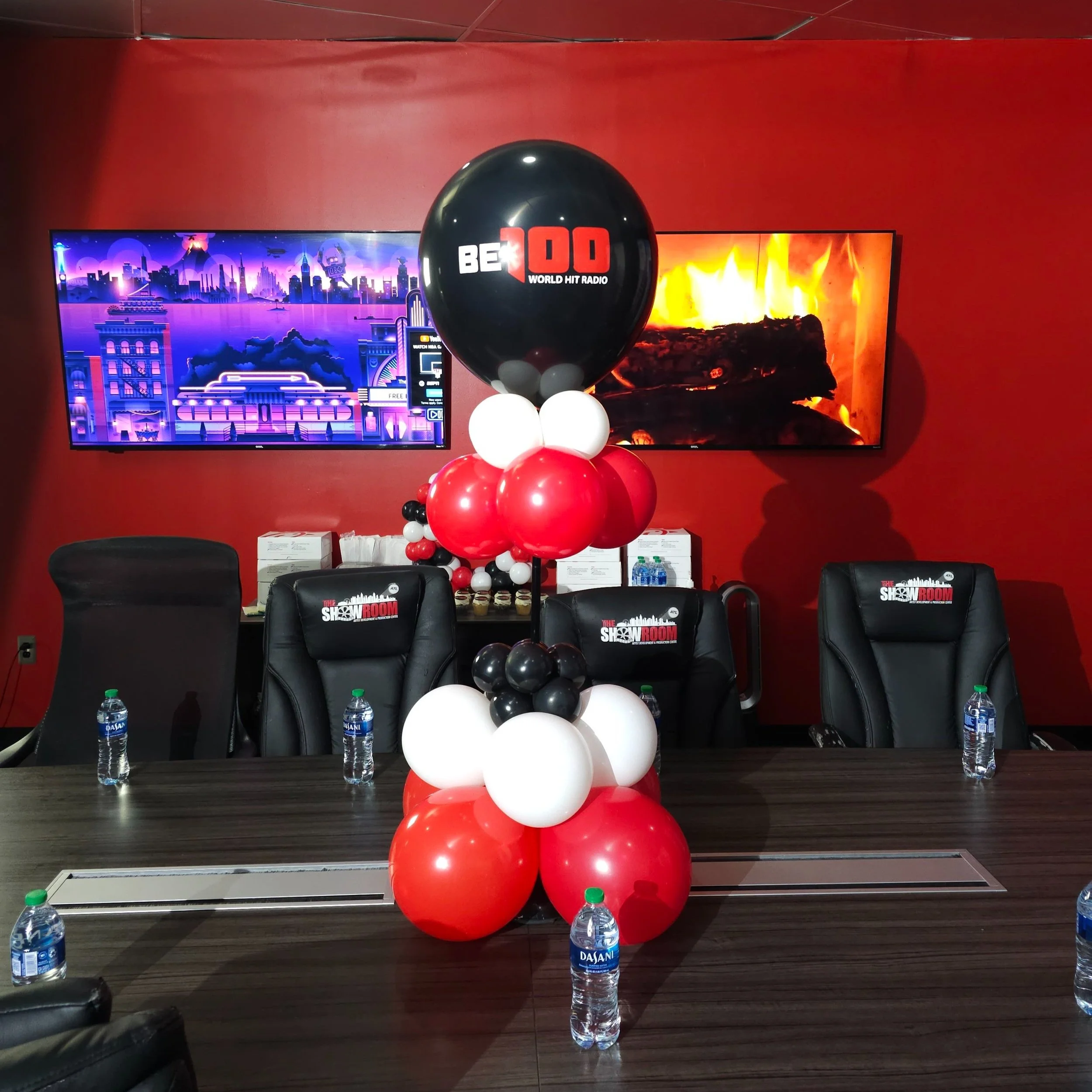 red, black, and white balloon table centerpiece with company logo for a corporate luncheon event in Atlanta