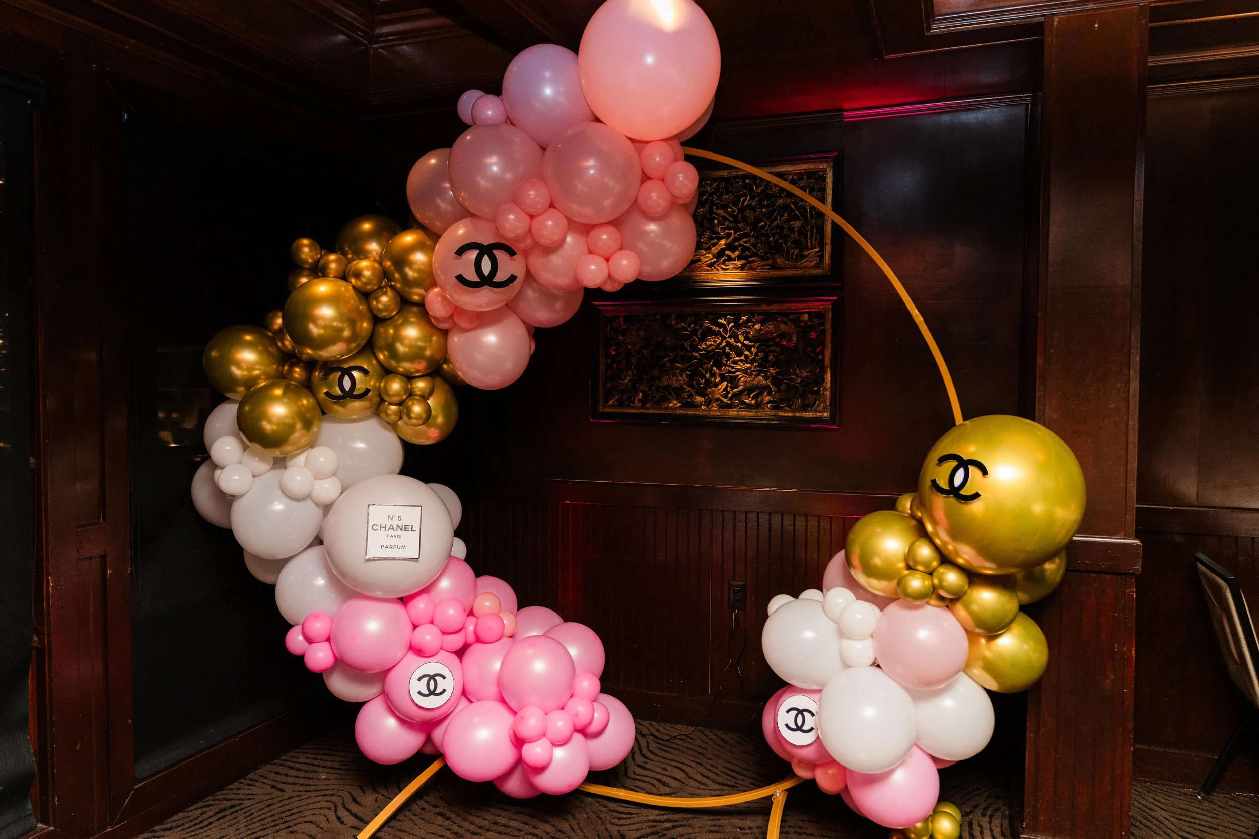 pink and gold Chanel themed graduation balloon hoop display in Atlanta