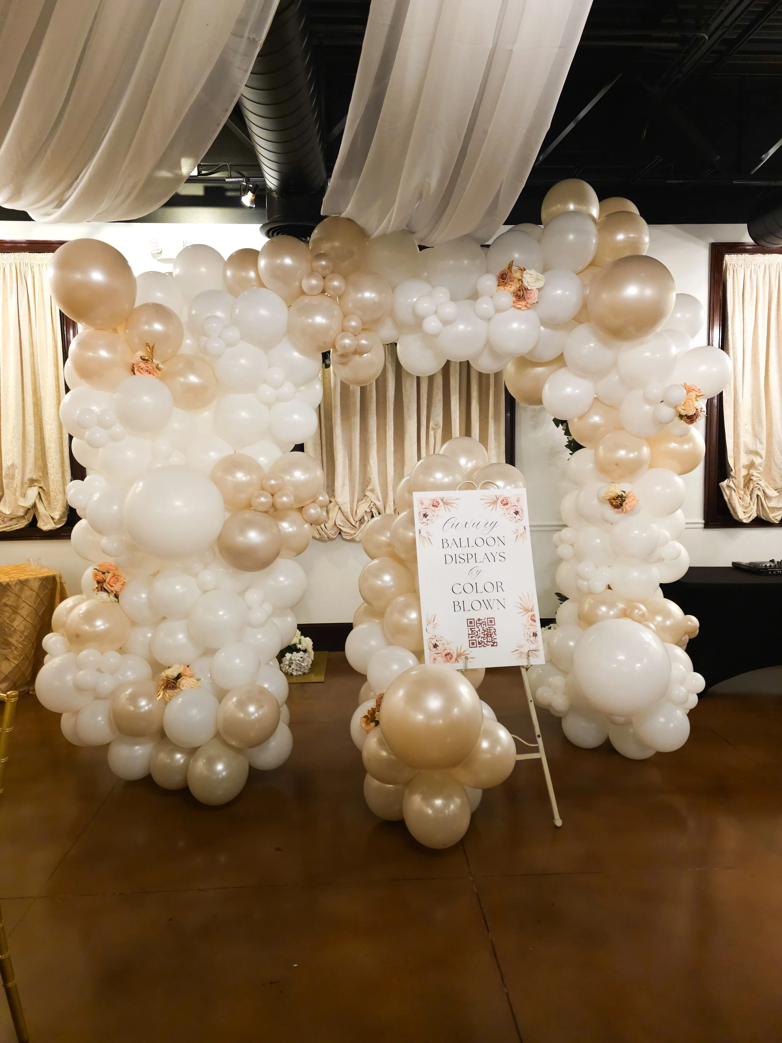 pearl and white balloon arch display for corporate networking event in Atlanta