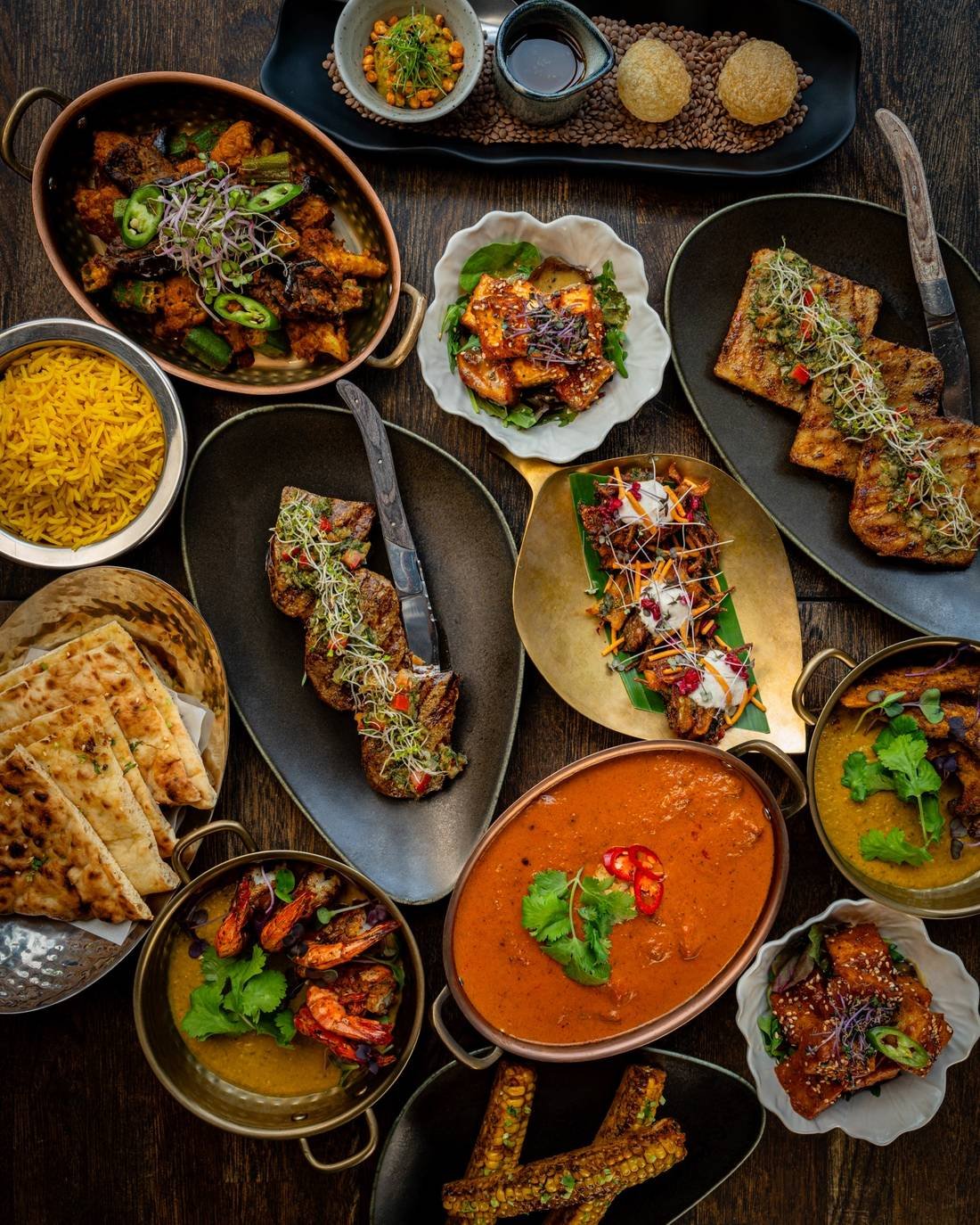 Zahida tasting spread with masala steak, tiger prawns, butter chicken, paneer, naan and saffron rice