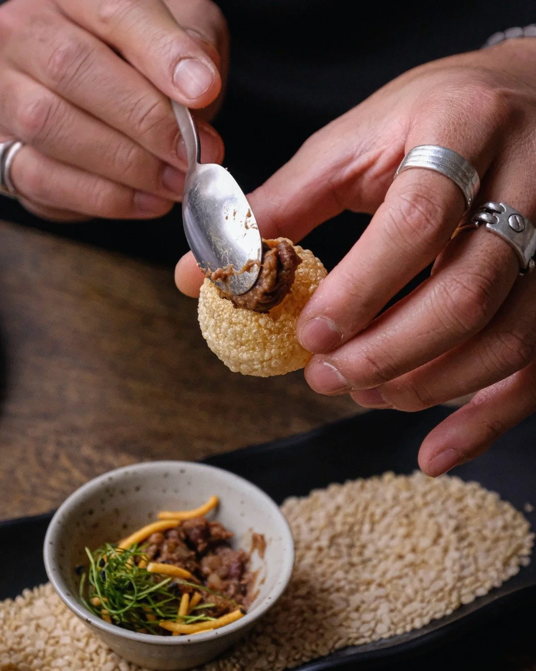 The perfect blend of crispy, sweet and spicy. Our tamarind bombs 🤍 

[fine dining, gourmet flavours, signature dishes, tasting menu, Fine dining Copenhagen, food with a story, indian food, Pakistani cuisine]