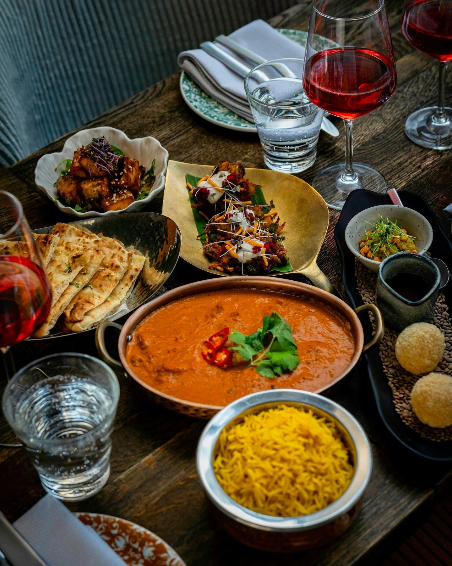 The best way to experience Zahida?

A table filled with dishes to share.

Bold spices, vibrant colours, freshly baked naan, signature favourites, and new seasonal creations, all arriving one after another. Because the best conversations always happen