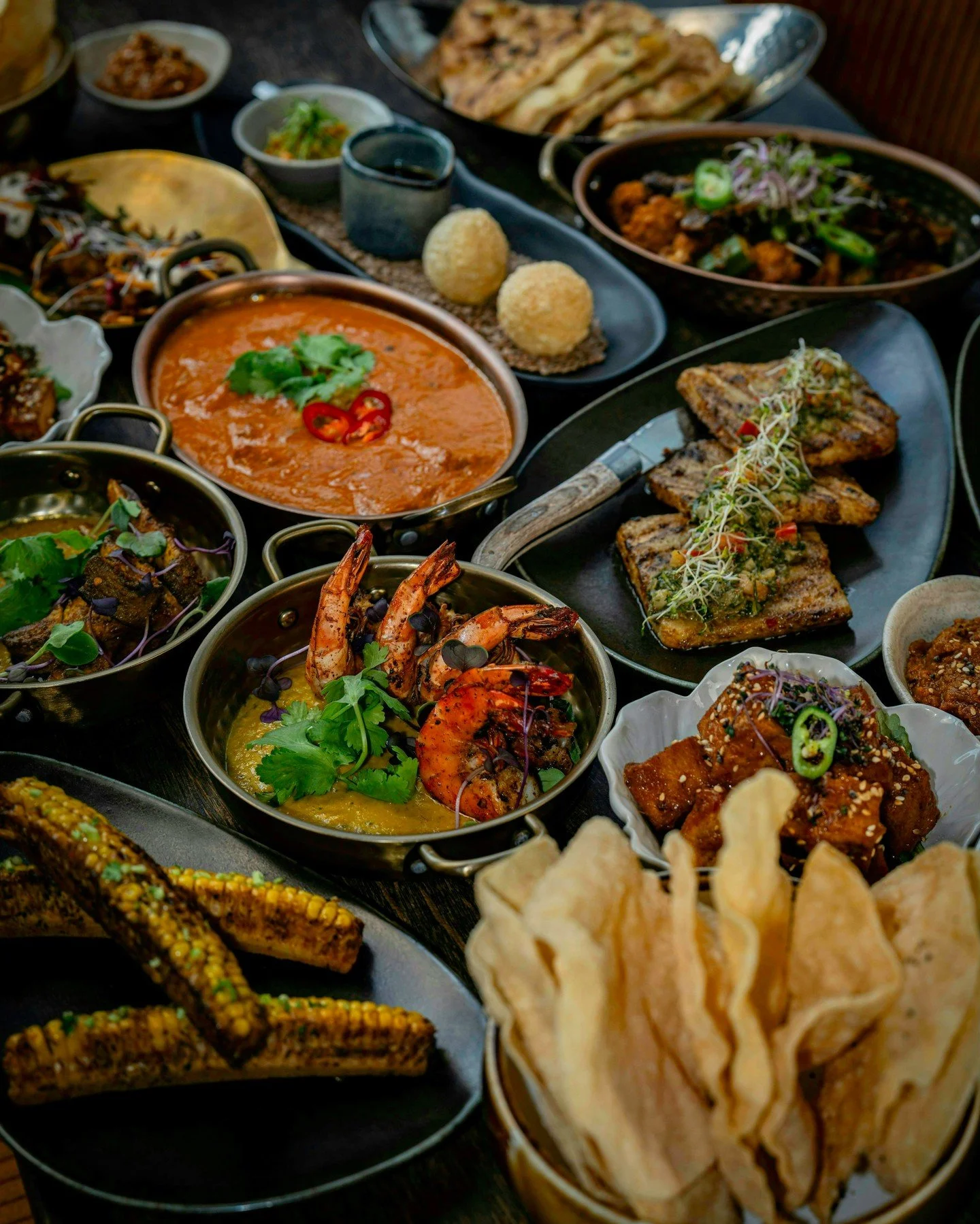 Nine dishes.
Countless layers of flavour.
Crisp pani puri, spicy paneer, smoky prawns, tender striploin, charred corn ribs, our signature butter chicken, freshly baked naan, and fragrant rice.
A summer menu inspired by the food we grew up with and th