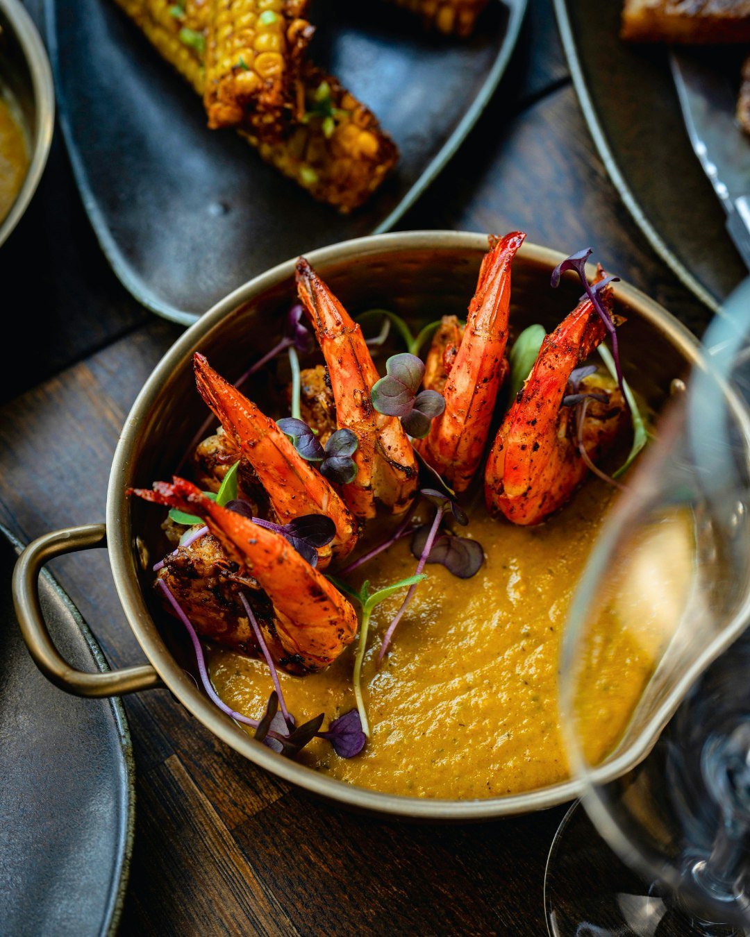 A taste of the coast 💛 
Our Grilled Kerala Prawn is one of the highlights of this summer's menu - smoky, succulent prawns served with a silky coconut sauce inspired by the flavours of Southern India.
Simple. Elegant. Full of flavour.
A dish made for