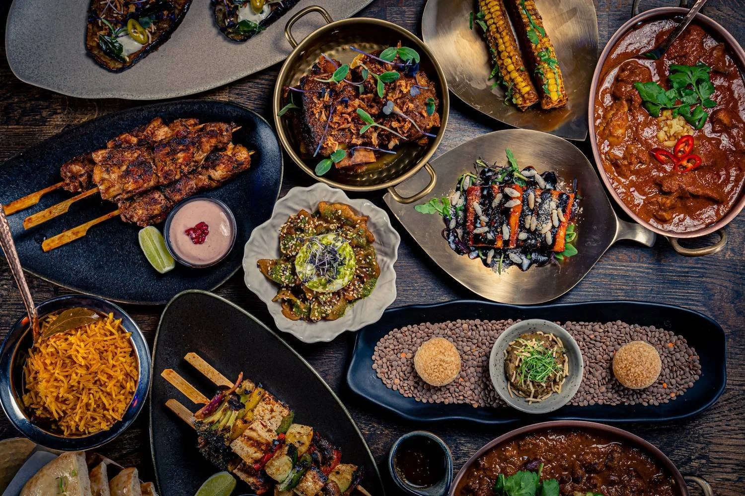 Tasting menu including gunpowder buratta, paneer 85, rajma masala, masala karahi rib roast, achari chicken seekh kebabs and baingan