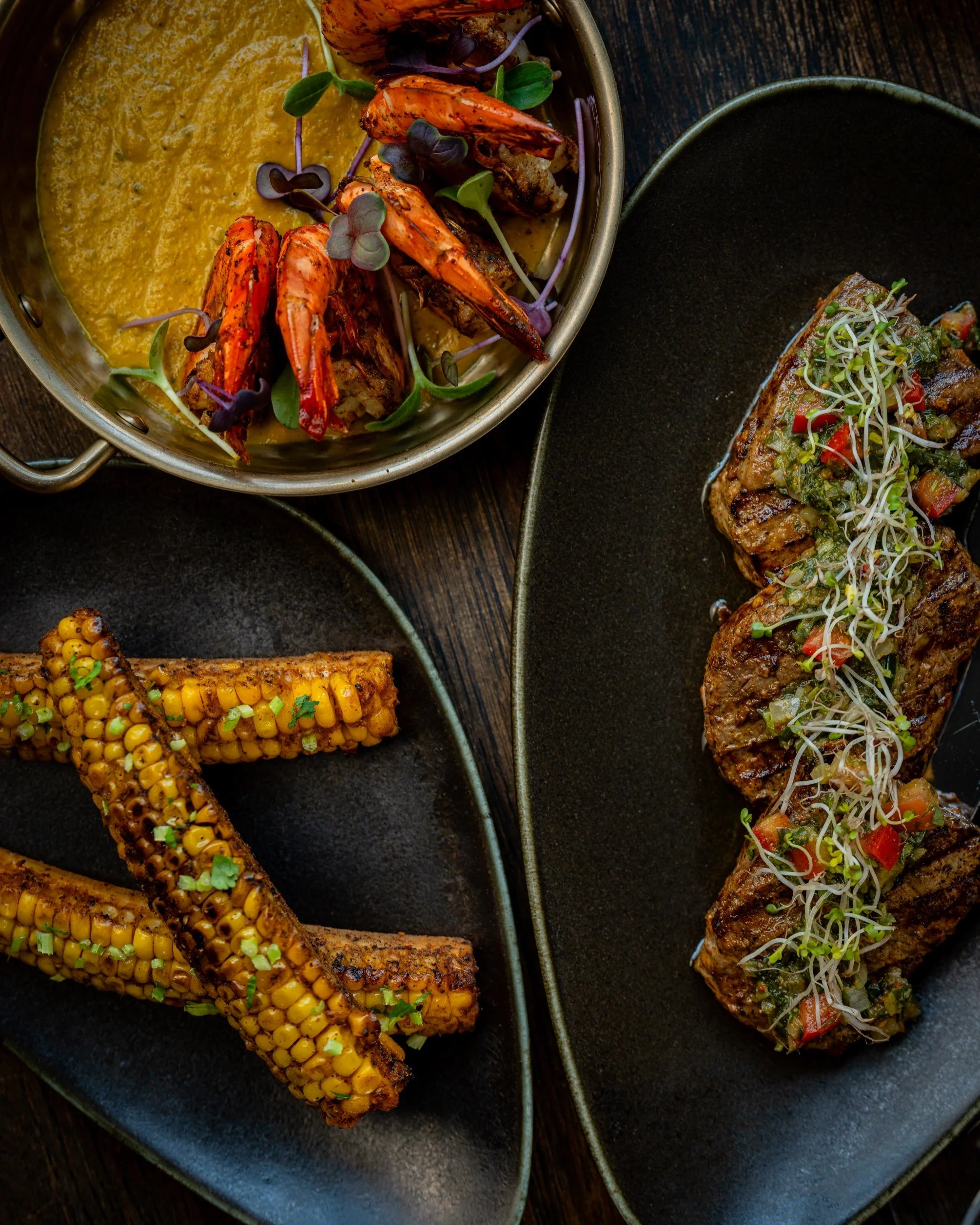 Masala striploin steak, tandoori corn ribs and kerala tiger prawns
