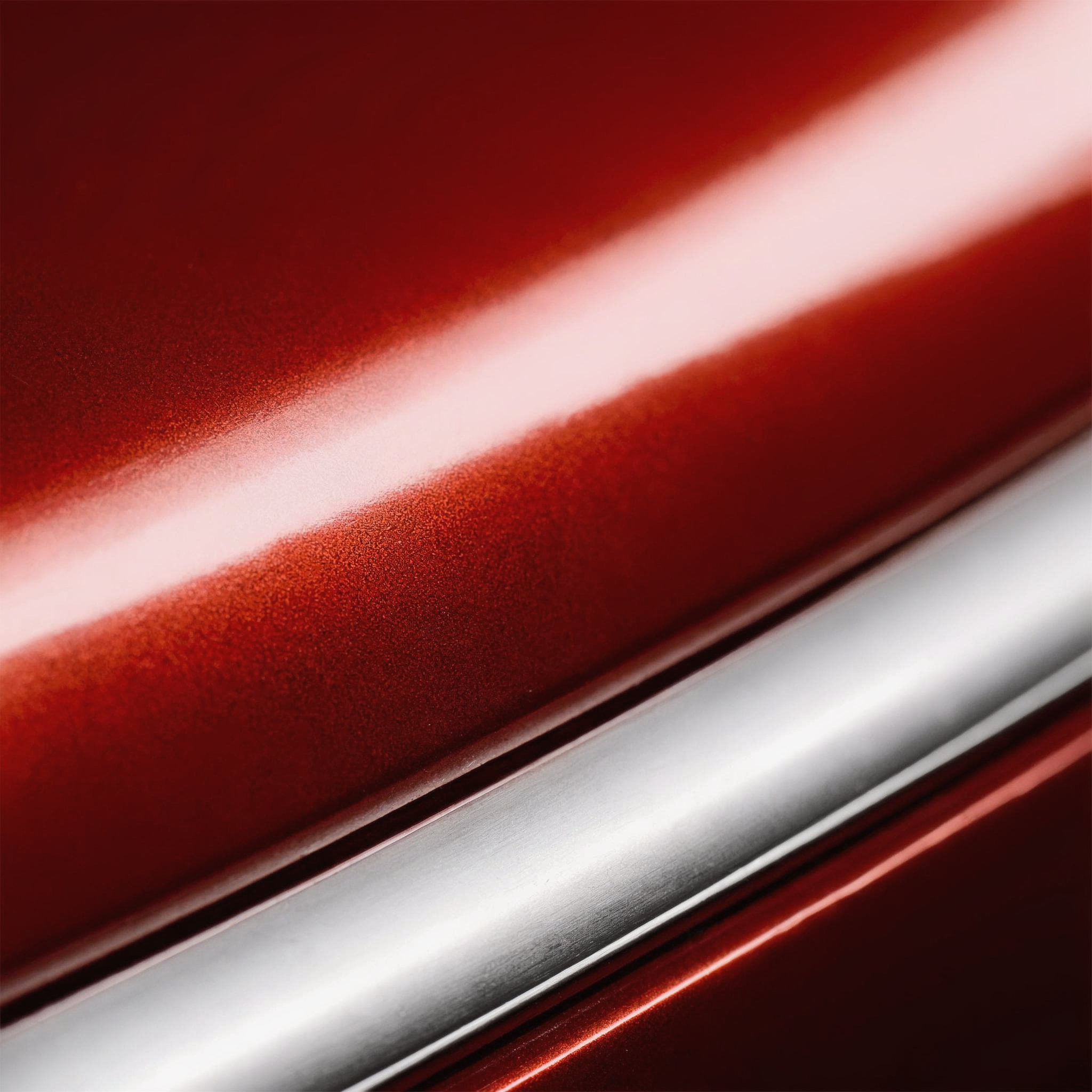 Car_Sculpture_Studio_A_polished_metallic_surface_in_a_deep_red_hue_is_dYUJ1L8z.png