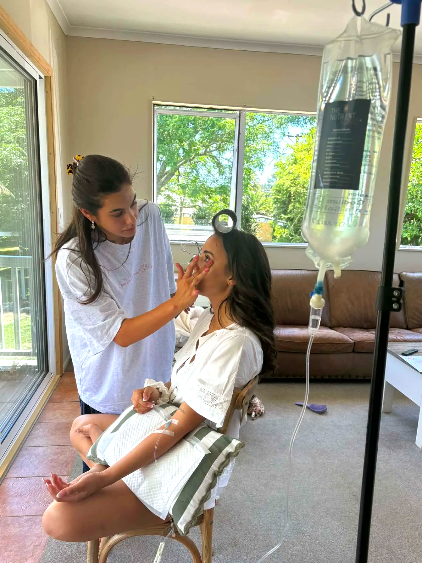 Bride receiving an IV vitamin drip on her wedding day for a radiant pre-wedding glow, hydration, and natural calm before walking down the aisle.