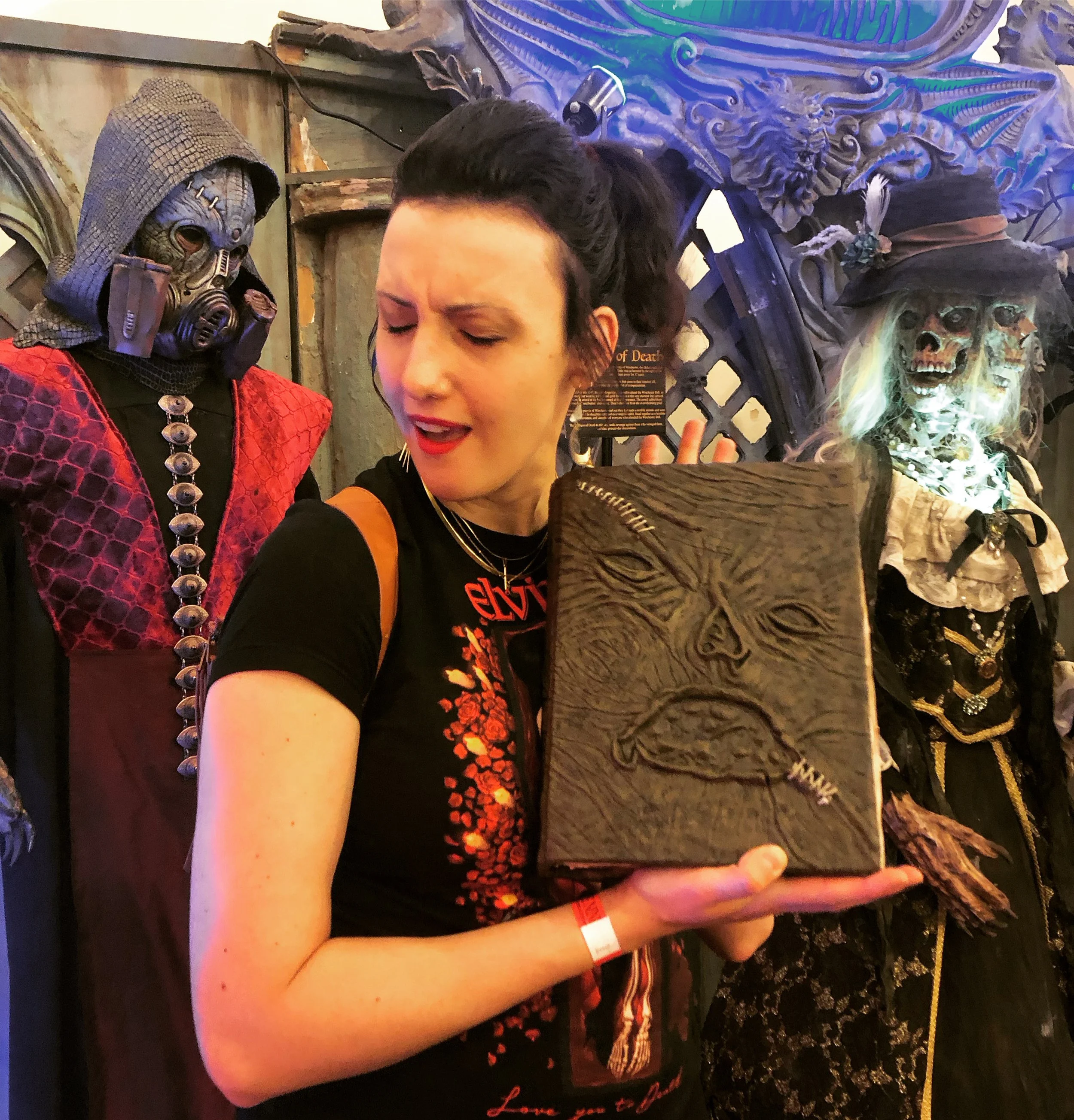 Chelsea lovingly holds a replica of the book from The Evil Dead at Monsterpalooza in Burbank, CA