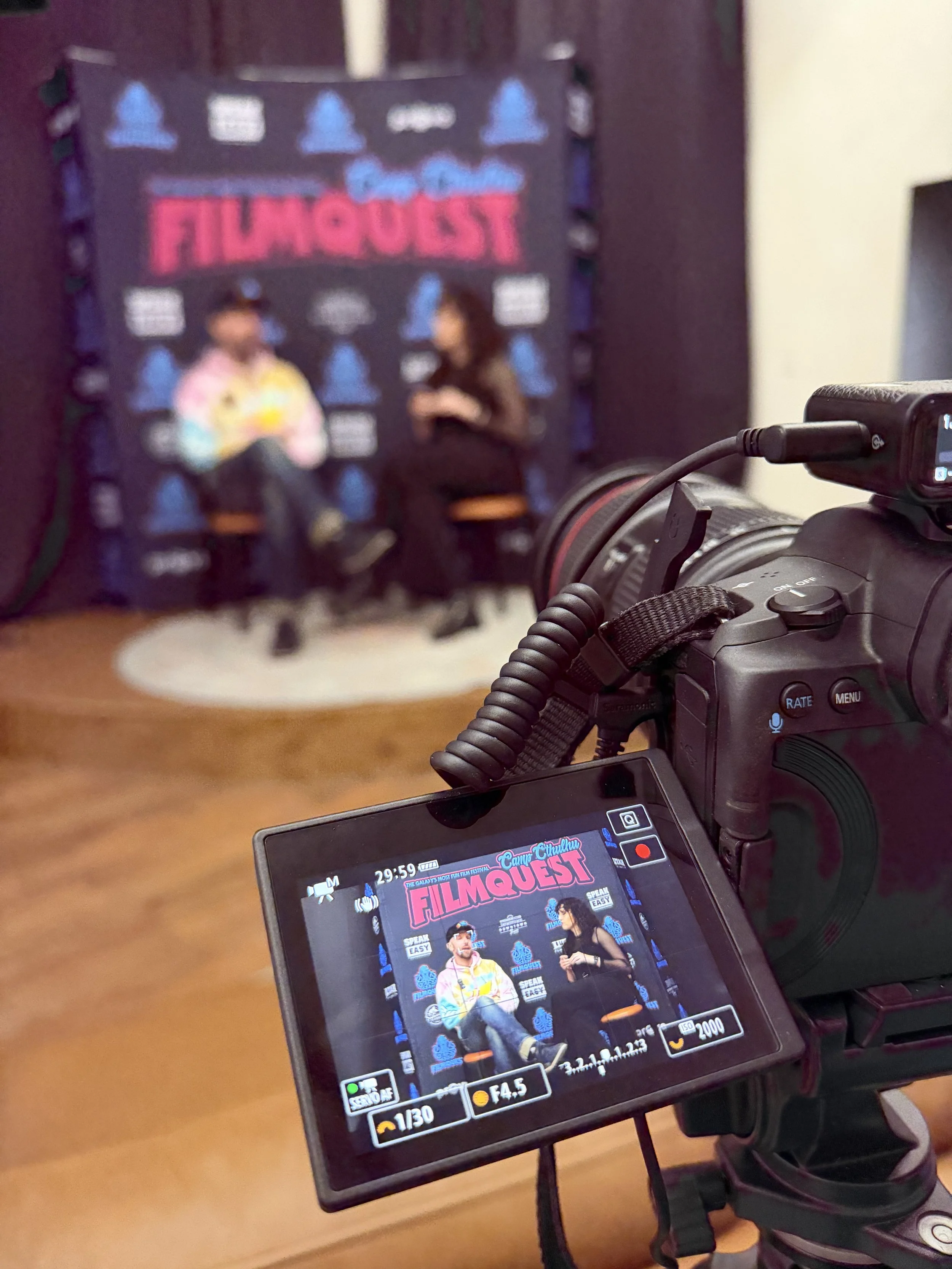Chelsea interviews an indie horror filmmaker at FilmQuest Film Festival in Provo, Utah in 2025