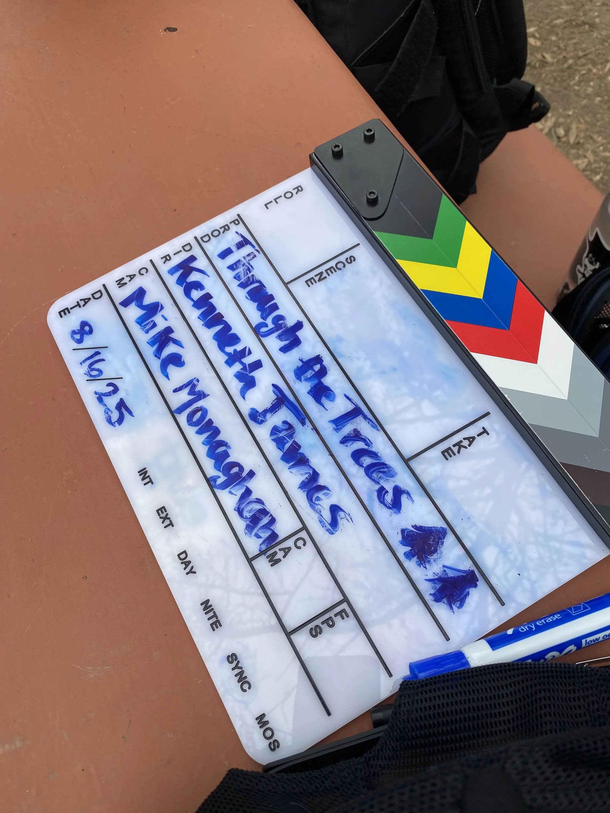 A clapper on top of a picnic bench in Griffith Park, CA for the indie horror short "Through the Trees" produced by Chelsea Beller