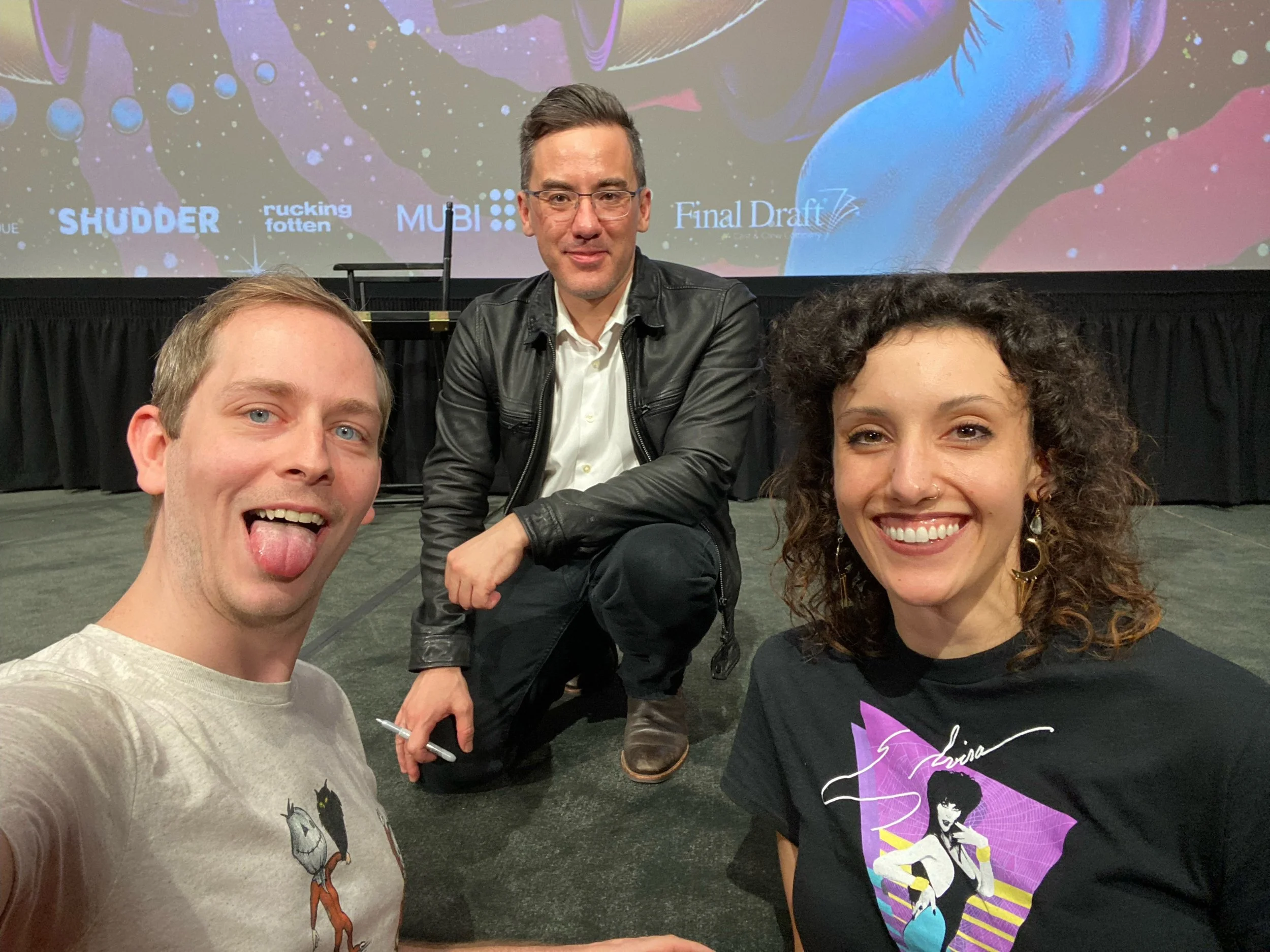 Chelsea Beller and Mike Monaghan pose with director of Trick'r'Treat Michael Dougherty