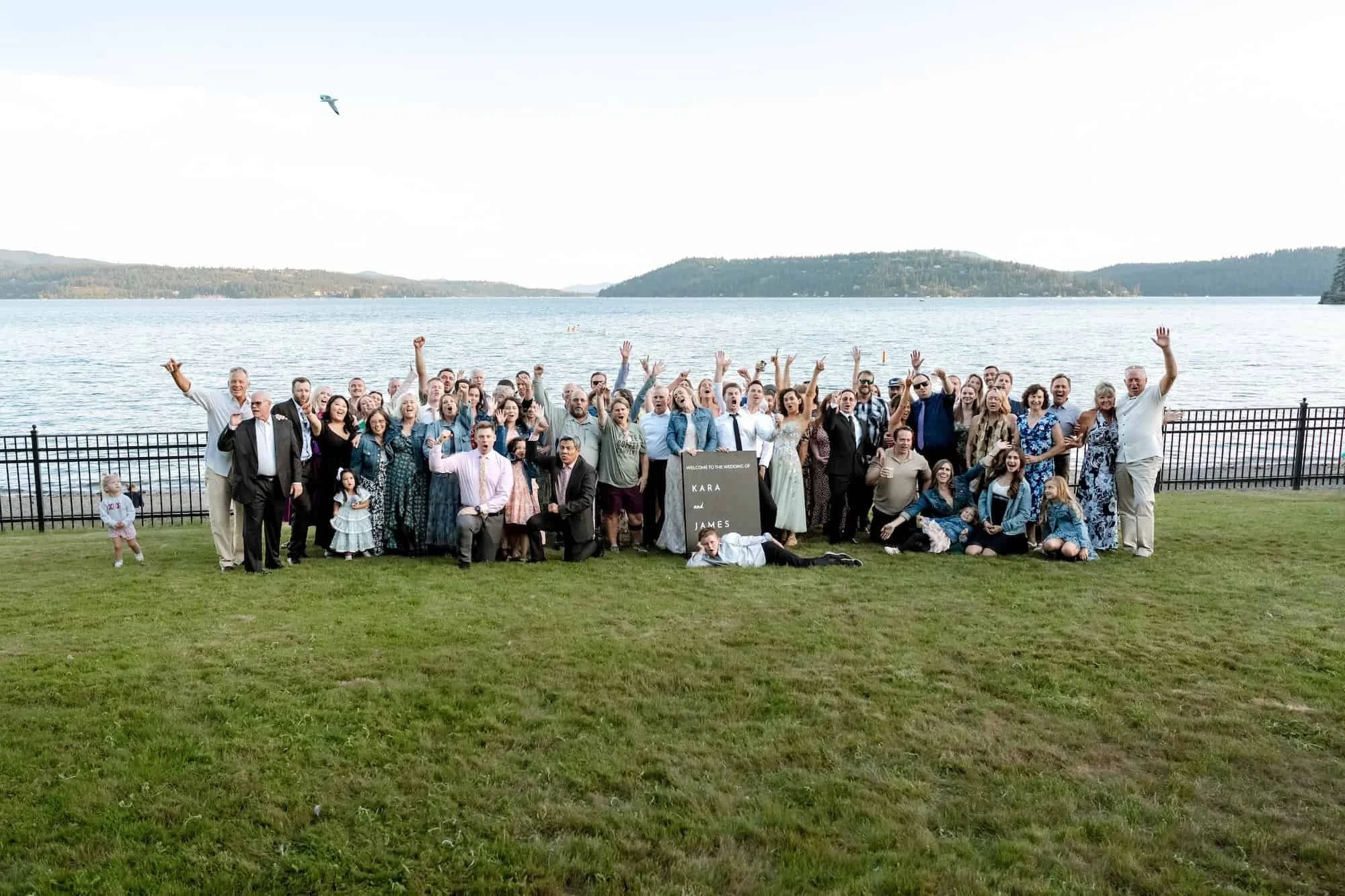 Wedding guest group shot by the lake