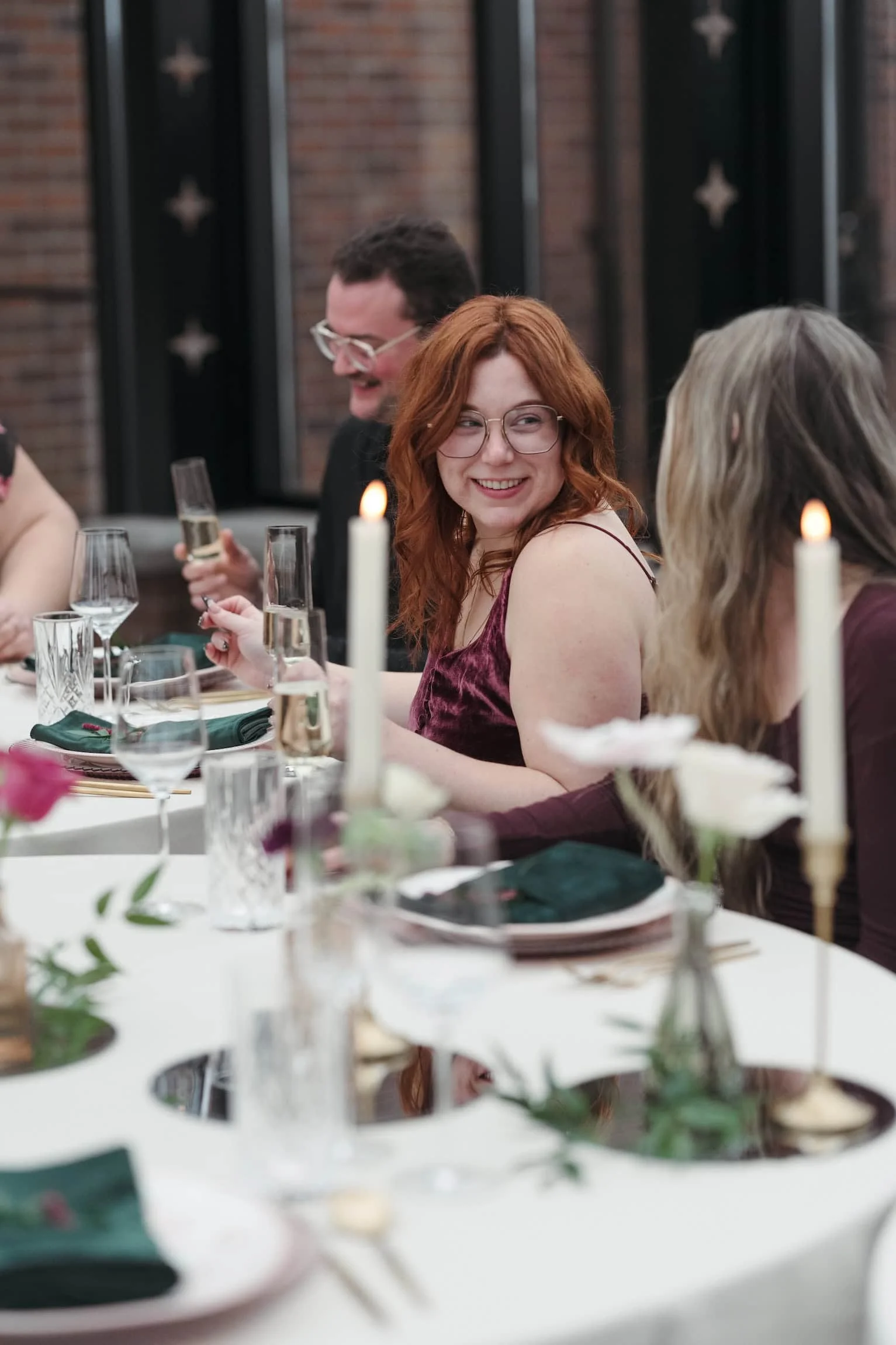 wedding guest with ginger hair and light skin tone at a wedding reception