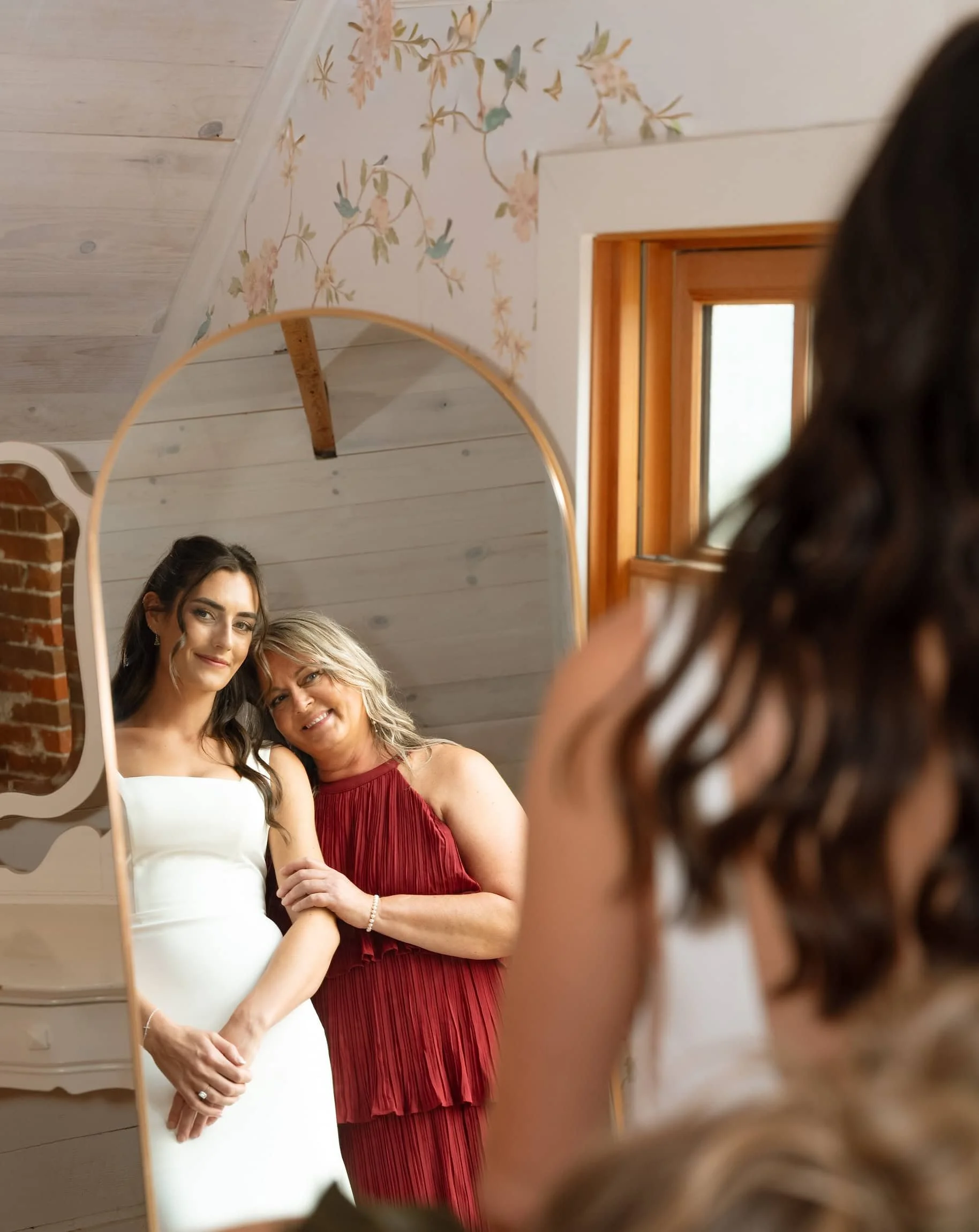 a brunette bride with her blond mother